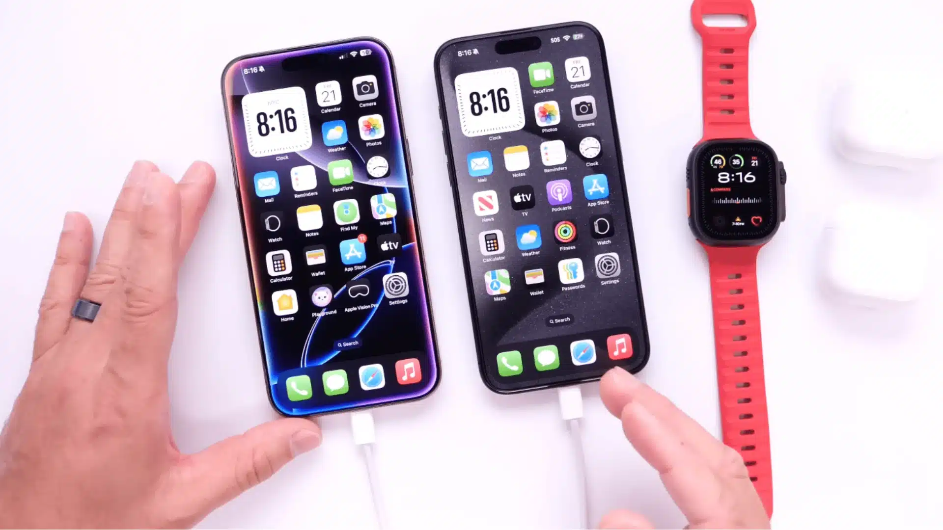 Close view of two iPhones plugged with charging cables while being used for setup and navigation