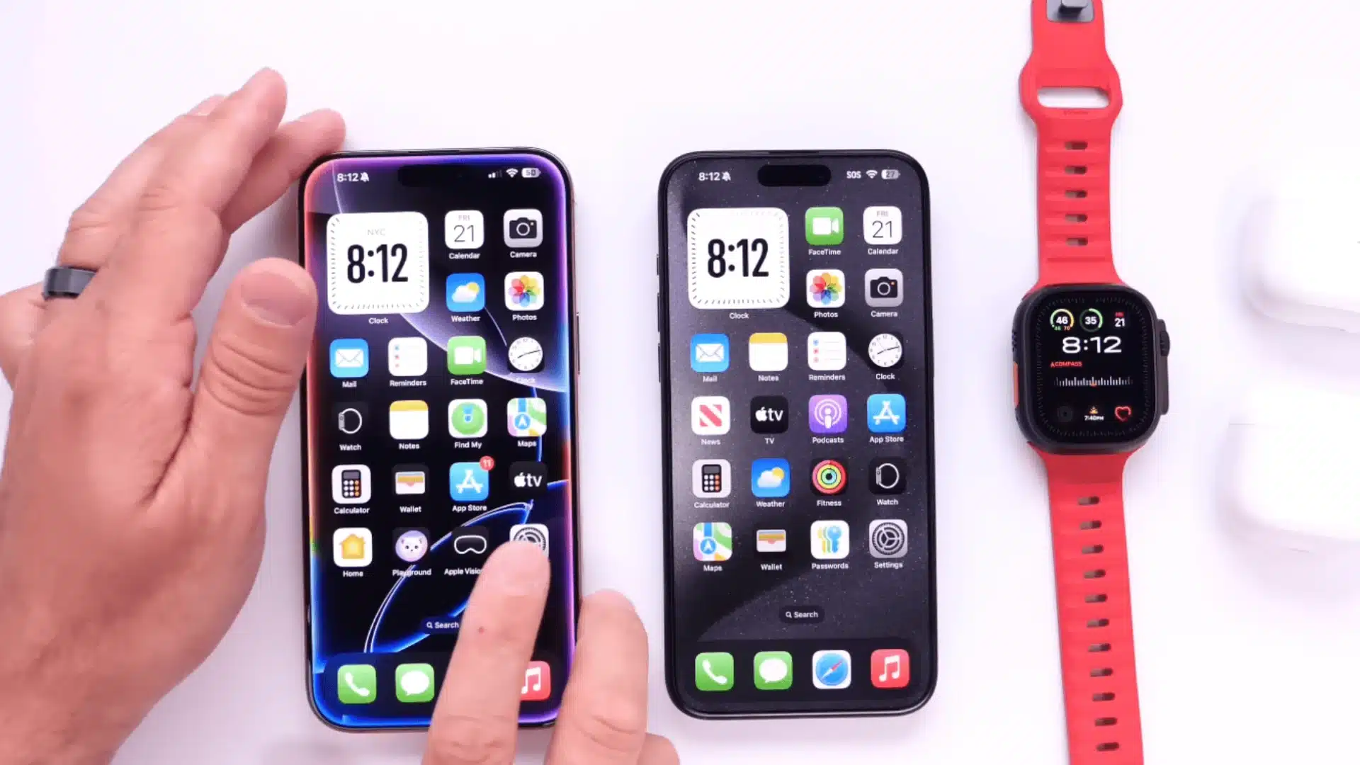 Two iPhones placed side by side on a white table showing compatibility and charging comparison