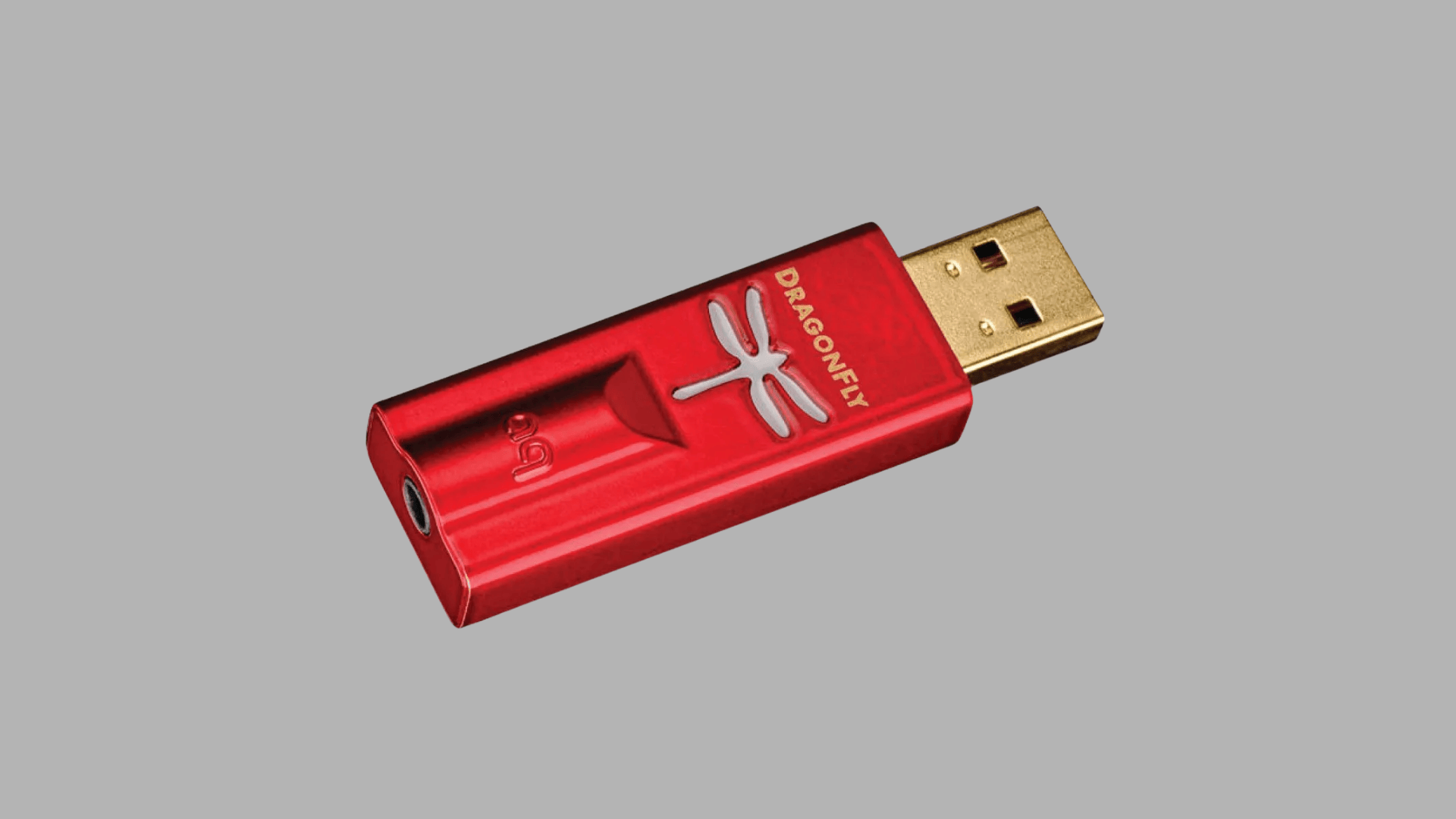 AudioQuest DragonFly Red USB DAC and headphone amplifier with red metal body, gold USB connector, and 3.5 mm headphone output port