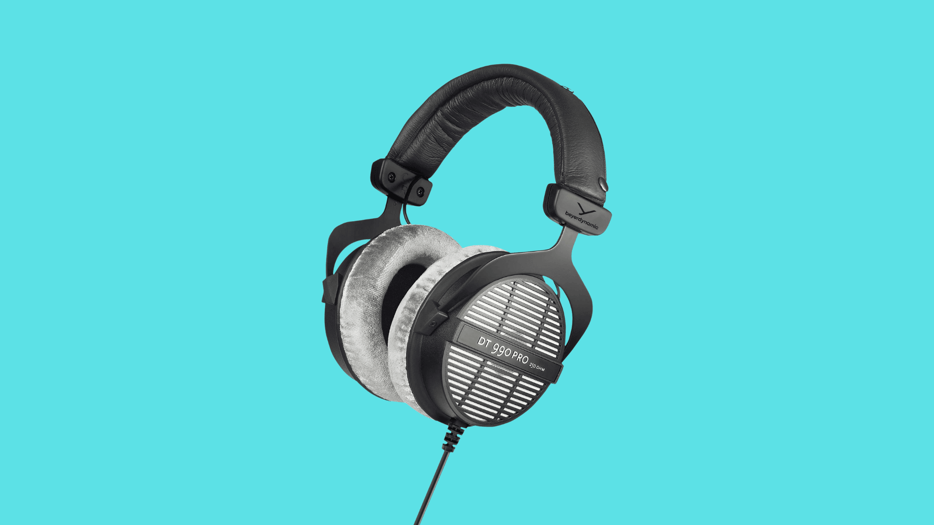 Beyerdynamic DT 990 Pro open-back studio headphones with velour ear pads, metal headband, wired cable, and wide detailed soundstage