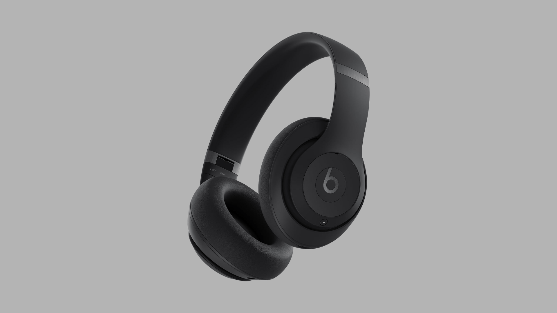 Black beats studio pro wireless over ear headphones with cushioned ear cups and headband design on light grey background