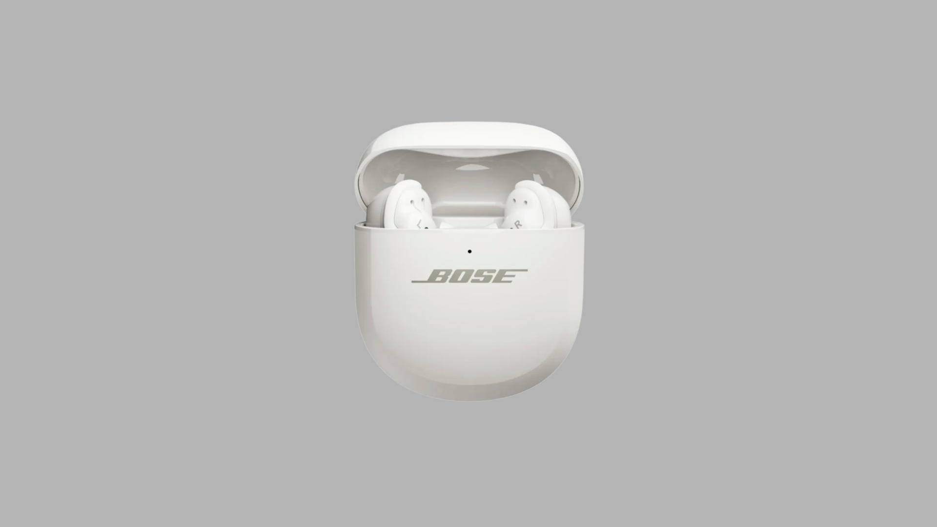 Bose QuietComfort Ultra earbuds in white charging case with lid open showing premium wireless earbuds design