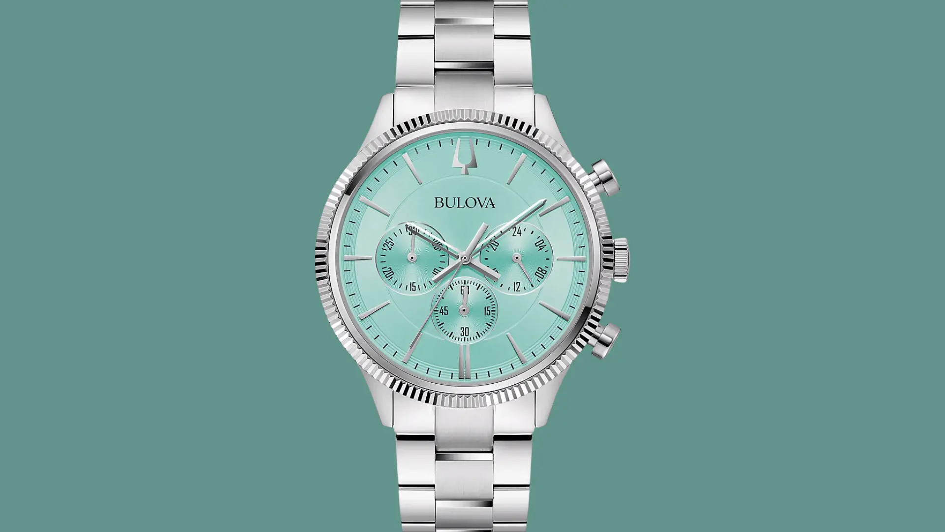 Bulova chronograph watch with mint green dial and stainless steel bracelet on a soft green background