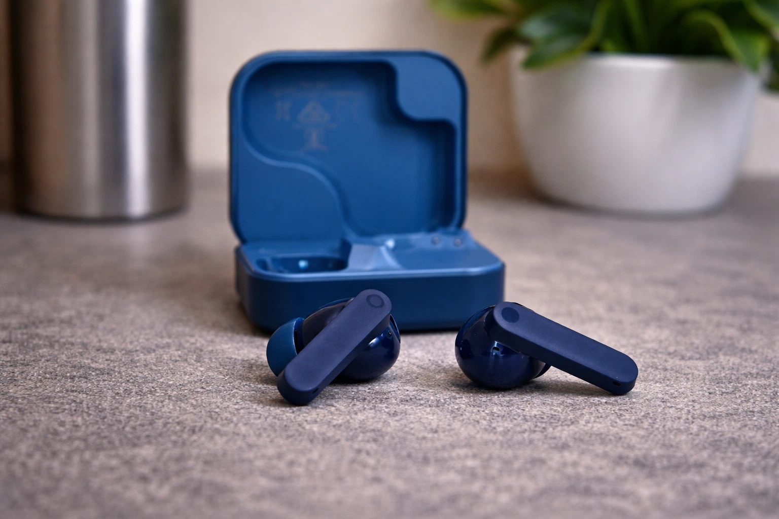 CMF Buds 2 Plus blue true wireless earbuds with charging case on tabletop