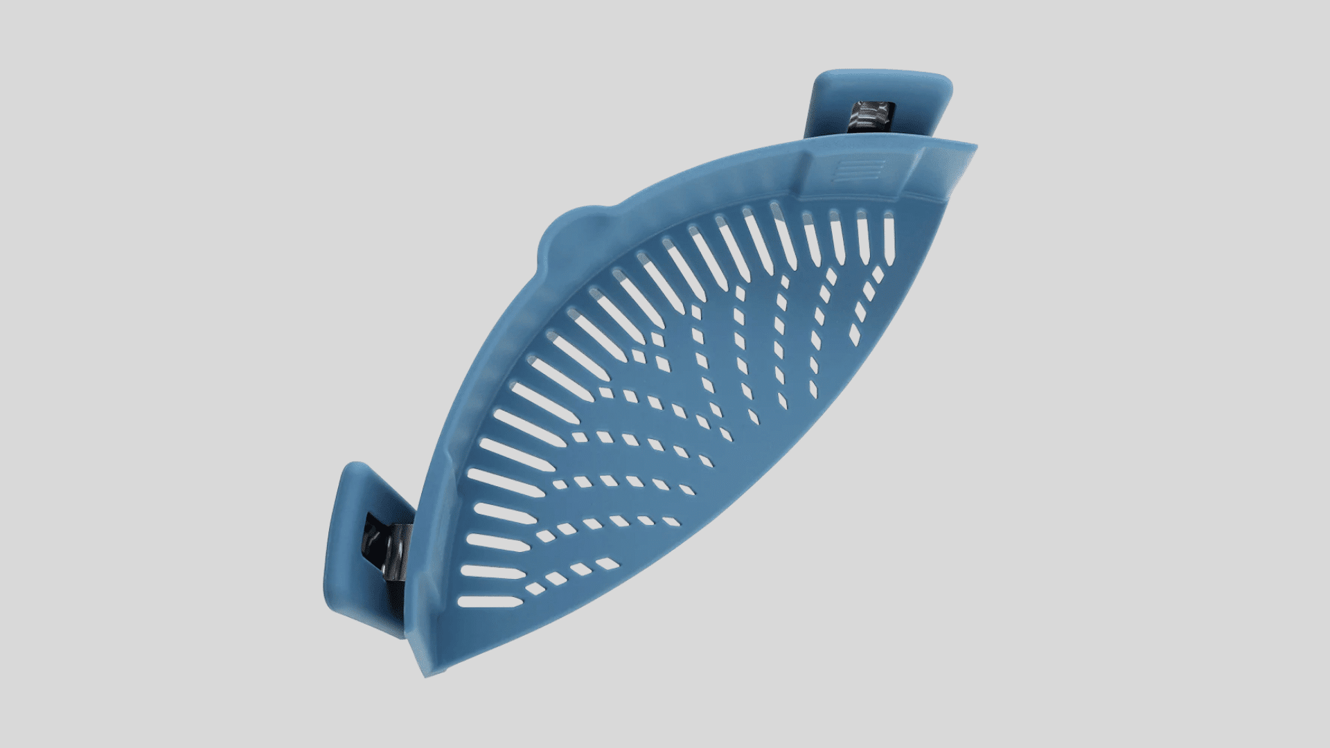 Clip on silicone pot strainer with flexible curved design for draining pasta and vegetables safely and easily