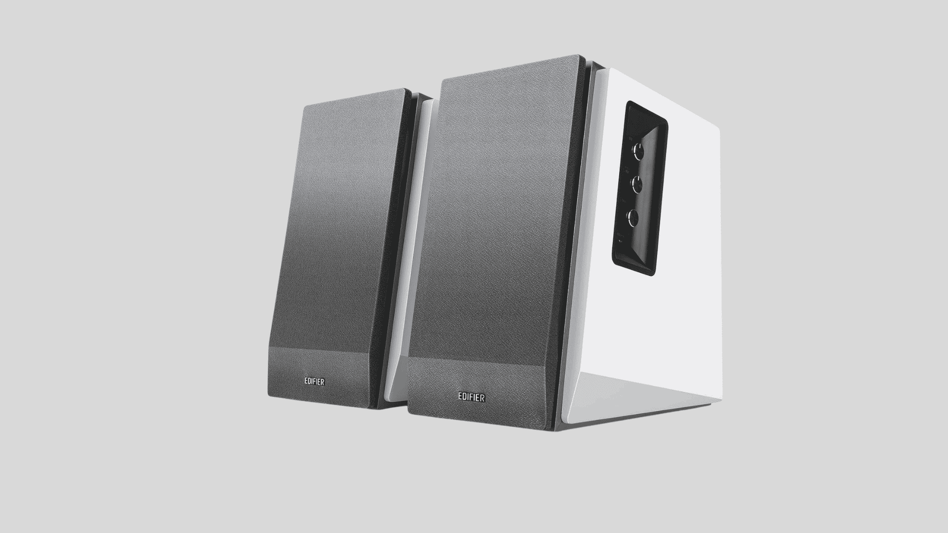 Edifier R1700BT bookshelf speakers with side controls and remote, showing compact desktop speaker design for home audio setup