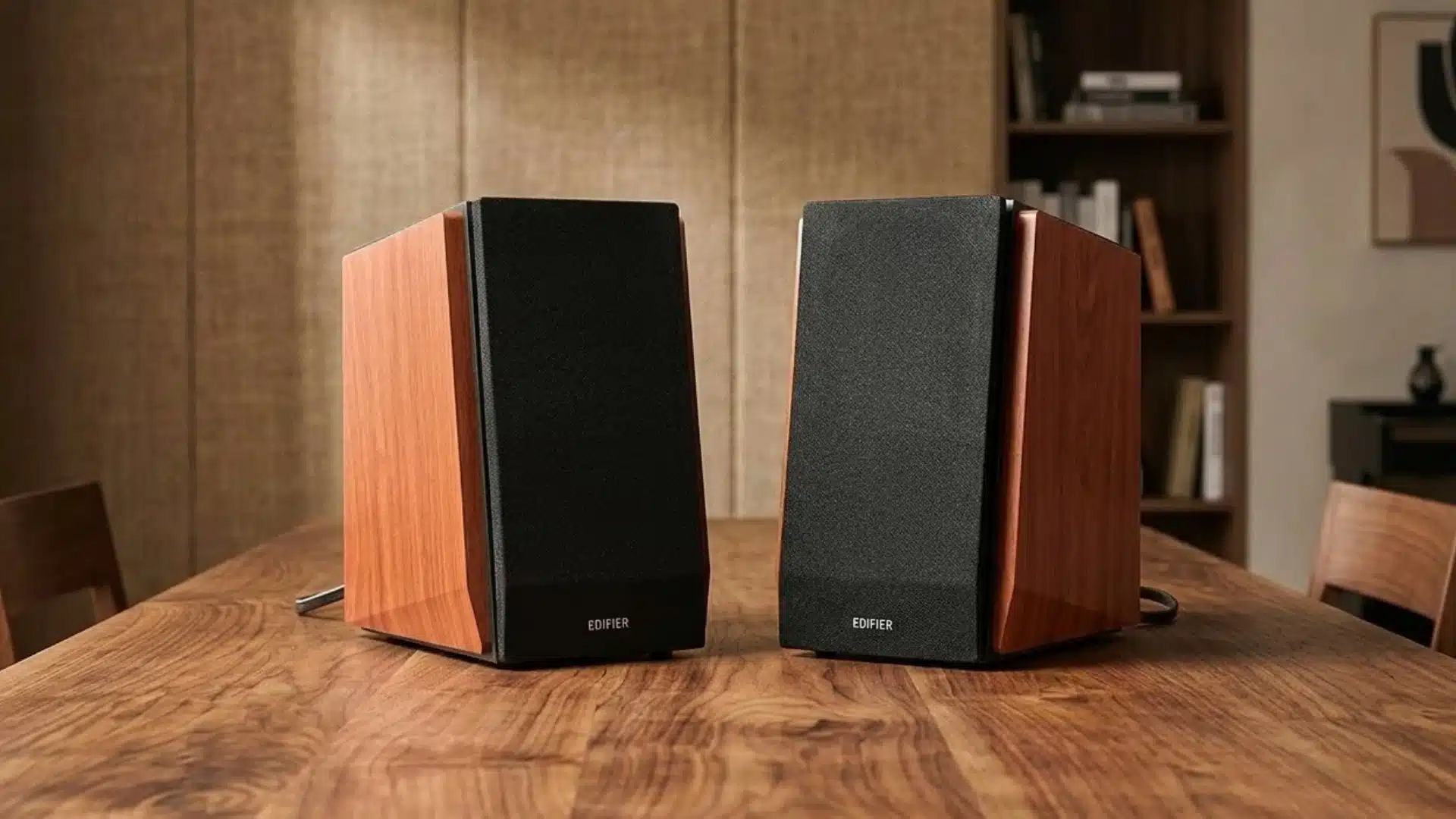 Edifier R1700BT bookshelf speakers with wooden cabinets placed on table, showing stereo speaker setup for home music and desktop audio use