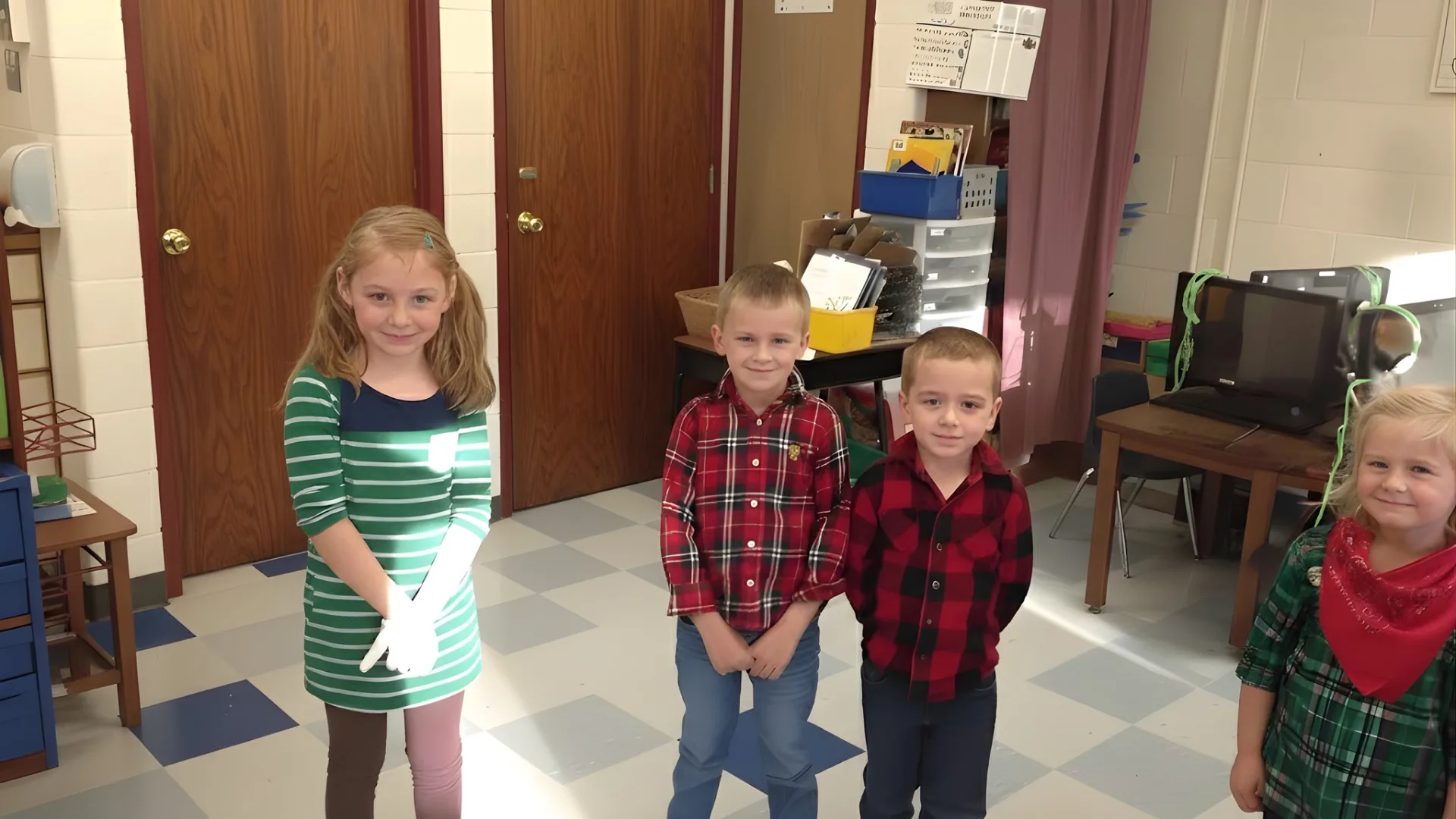 Elementary students dressed in plaid and themed outfits during Spirit Week celebration inside a classroom setting