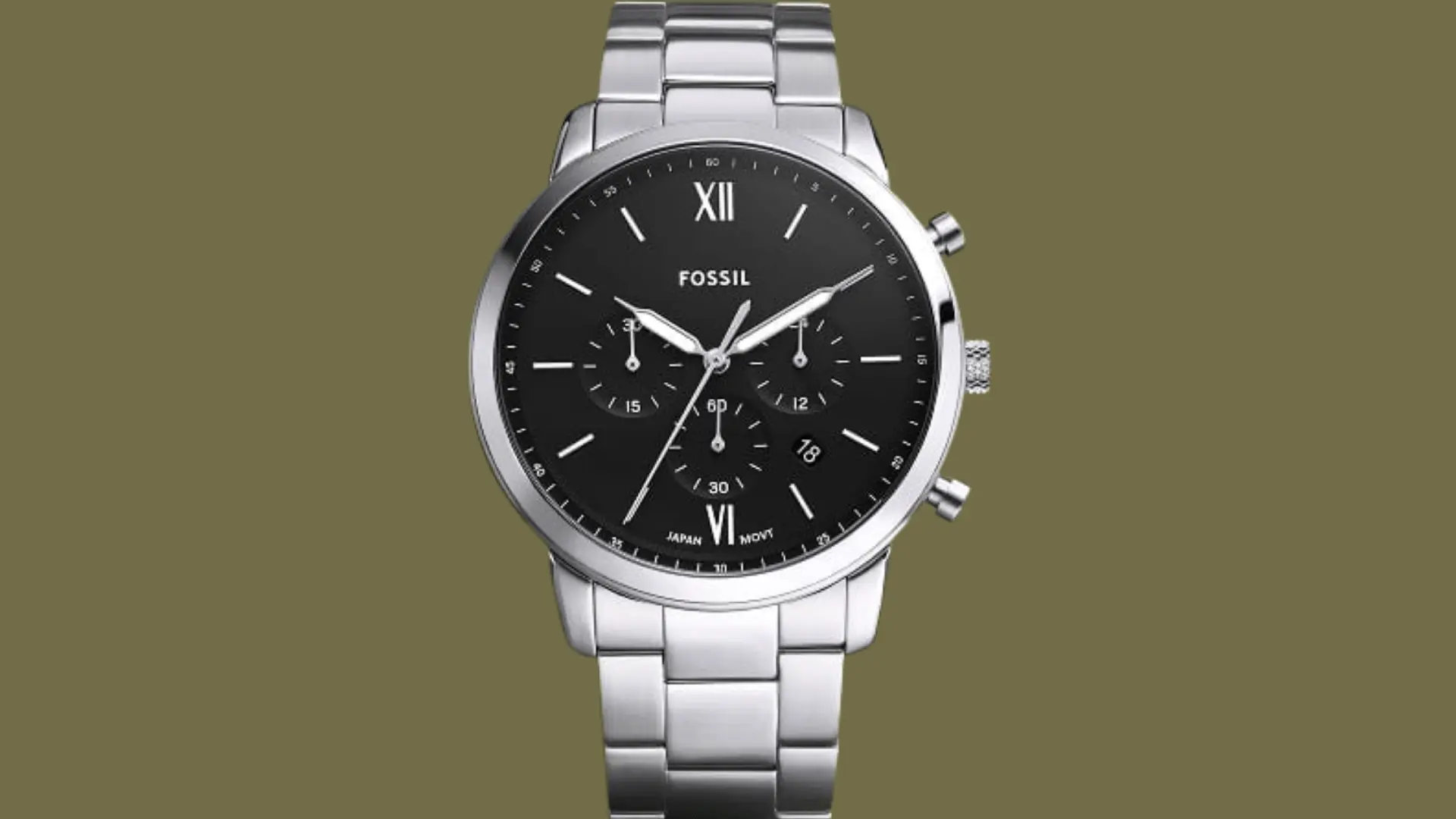 Fossil stainless steel chronograph watch with black dial and date display against a minimal olive background