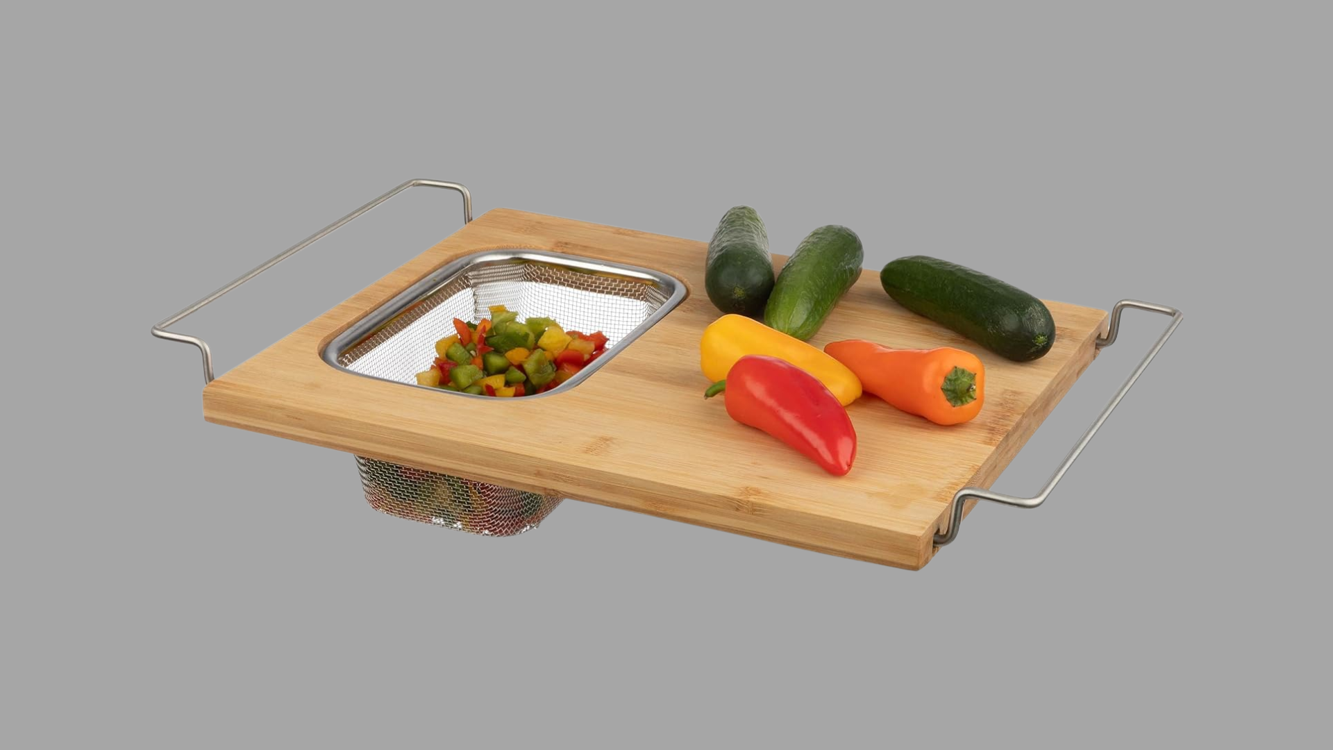 Over the sink bamboo cutting board with built in colander for washing and chopping vegetables in one place