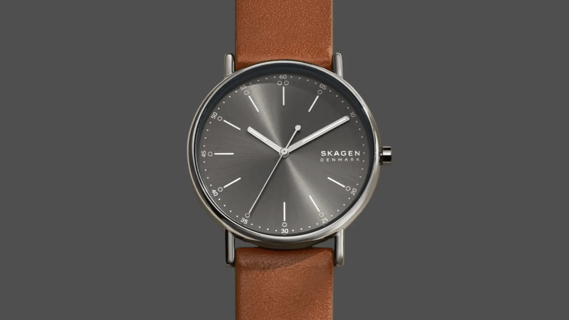 Skagen Denmark minimalist watch with gray dial and brown leather strap displayed on a clean neutral background