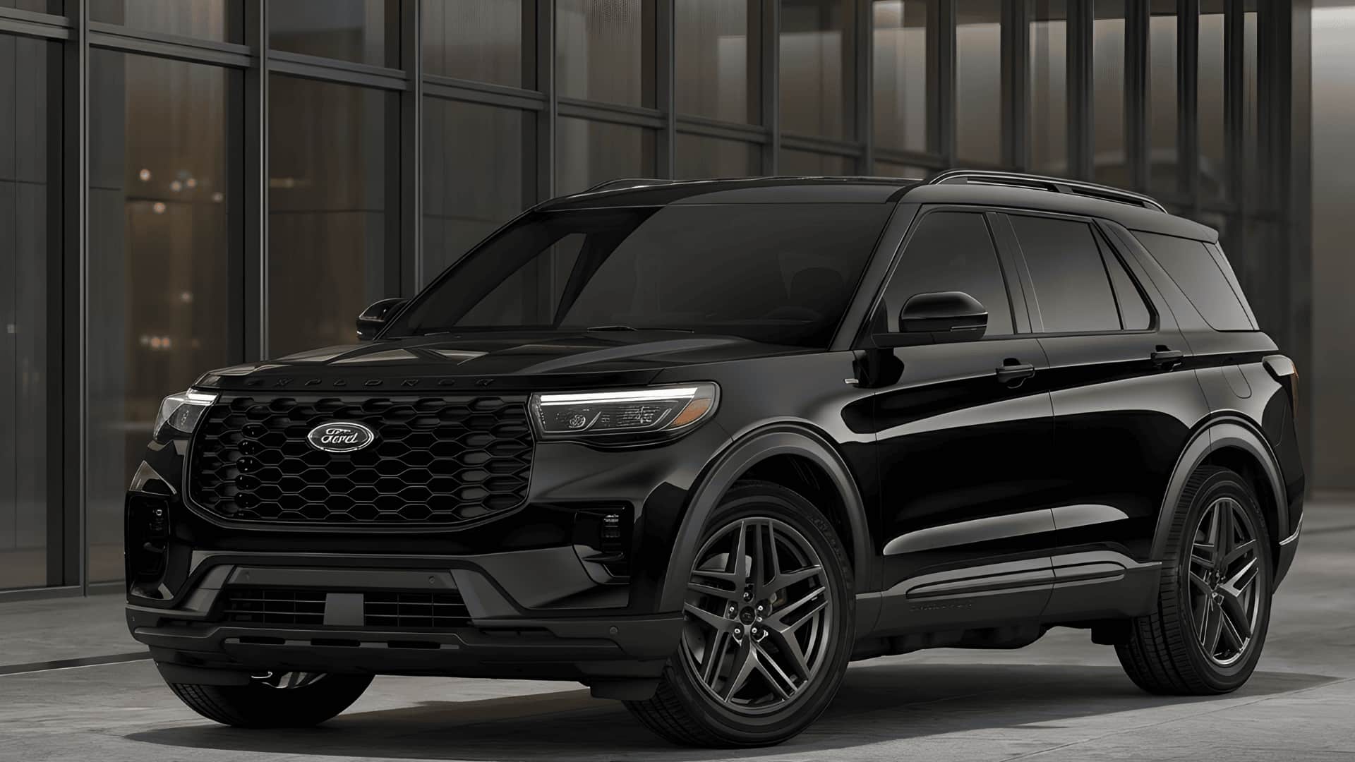 A sleek black Ford Explorer ST SUV parked outside a modern glass building