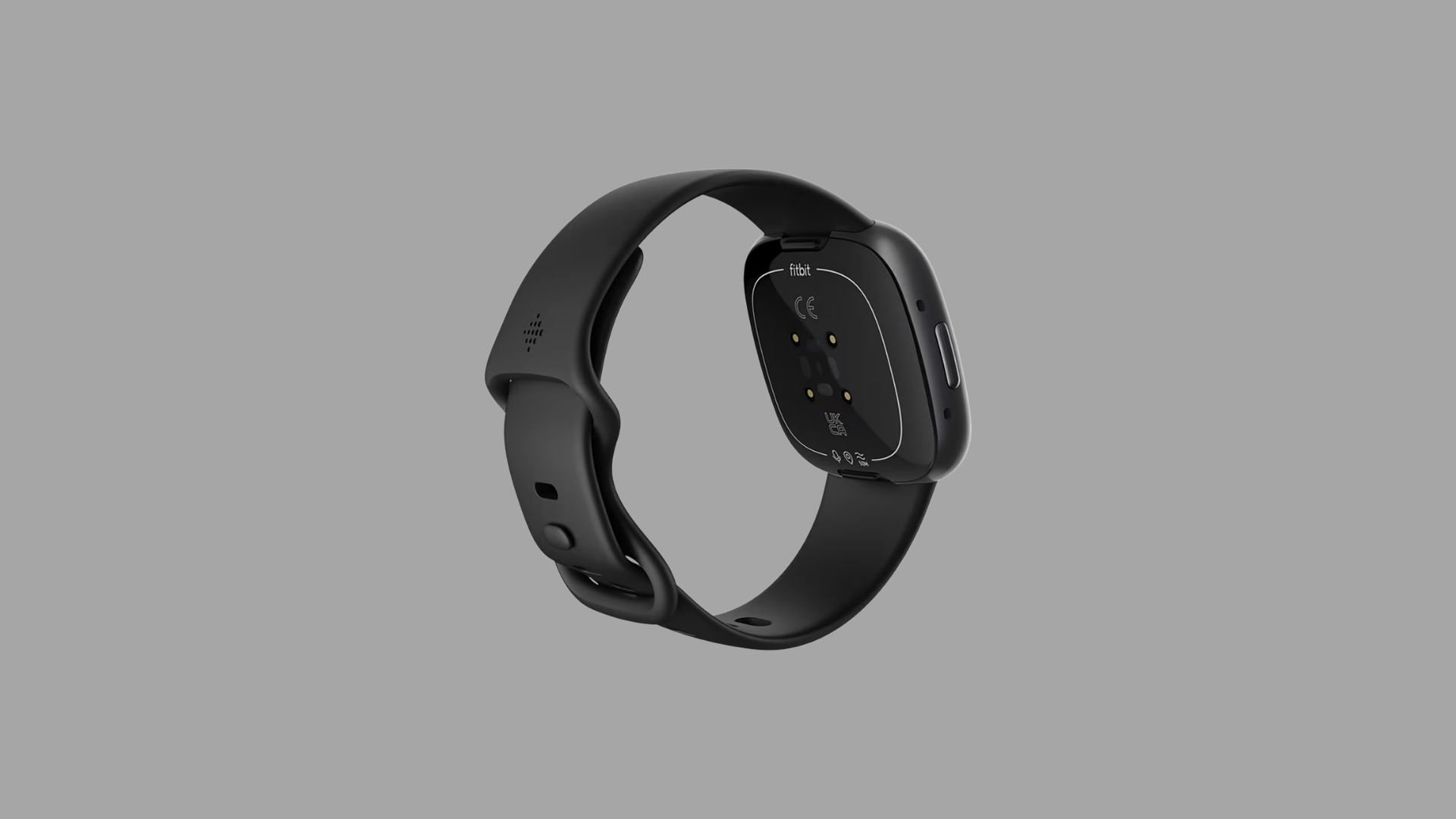 Back view of Fitbit Versa smartwatch in black showing heart rate sensors and silicone strap design