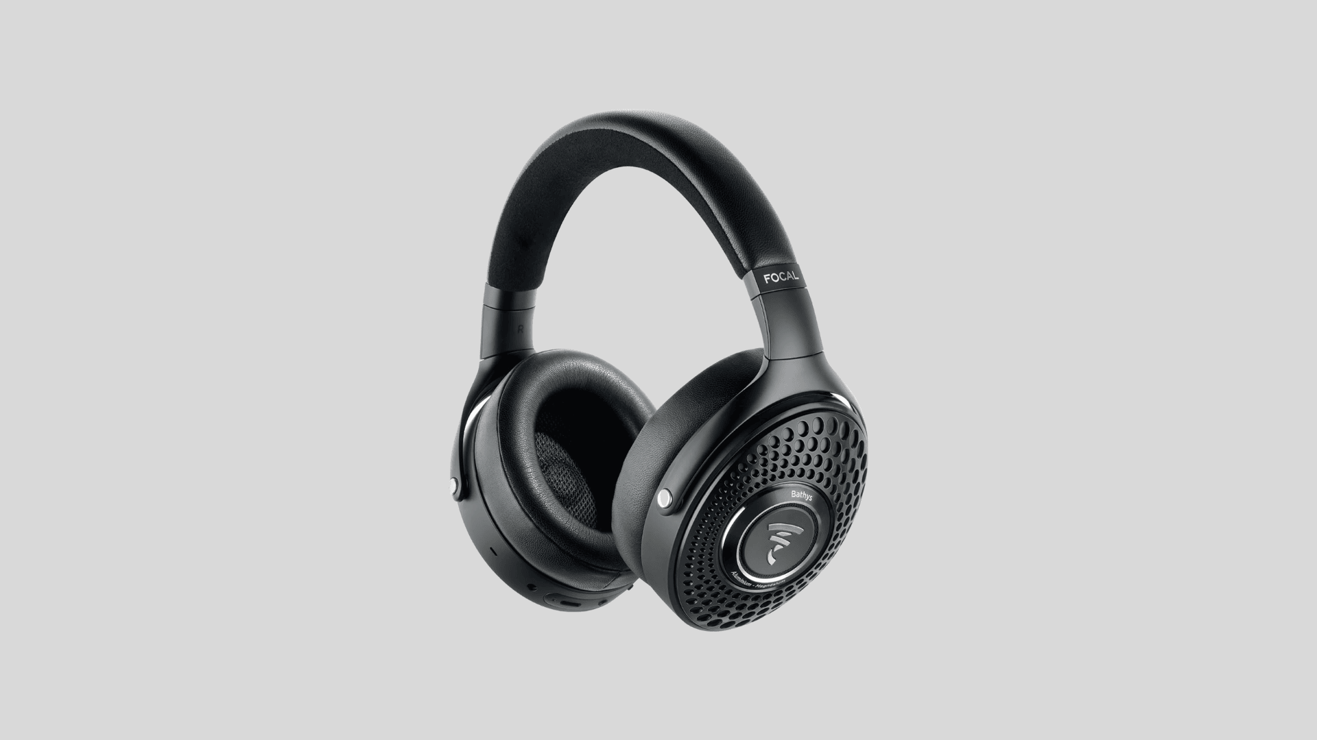 Focal Bathys wireless headphones showing premium build with leather headband, aluminum magnesium design, and perforated ear cups