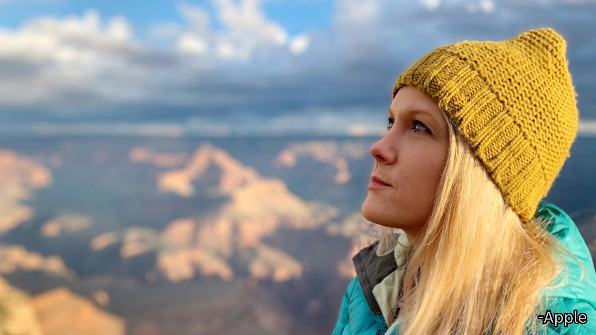 Portrait shot from iPhone XR showing sharp facial detail, natural colors, and blurred mountain background with depth effect