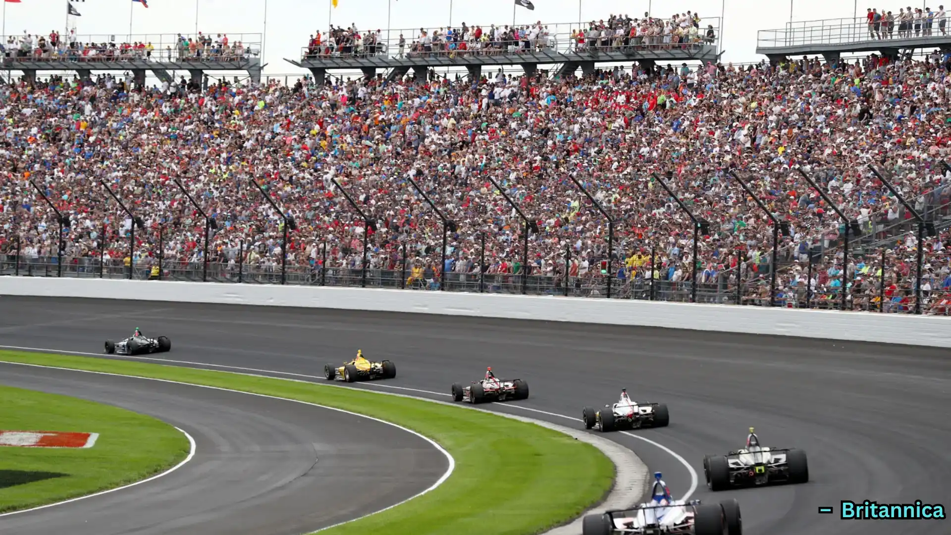 Race cars speeding on track with large crowd in grandstands, spectators watching motorsport event in stadium