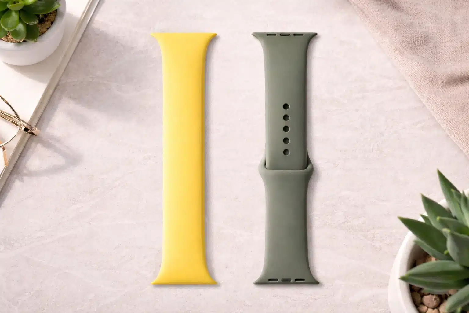 Yellow solo loop and green sport band showing design and closure differences