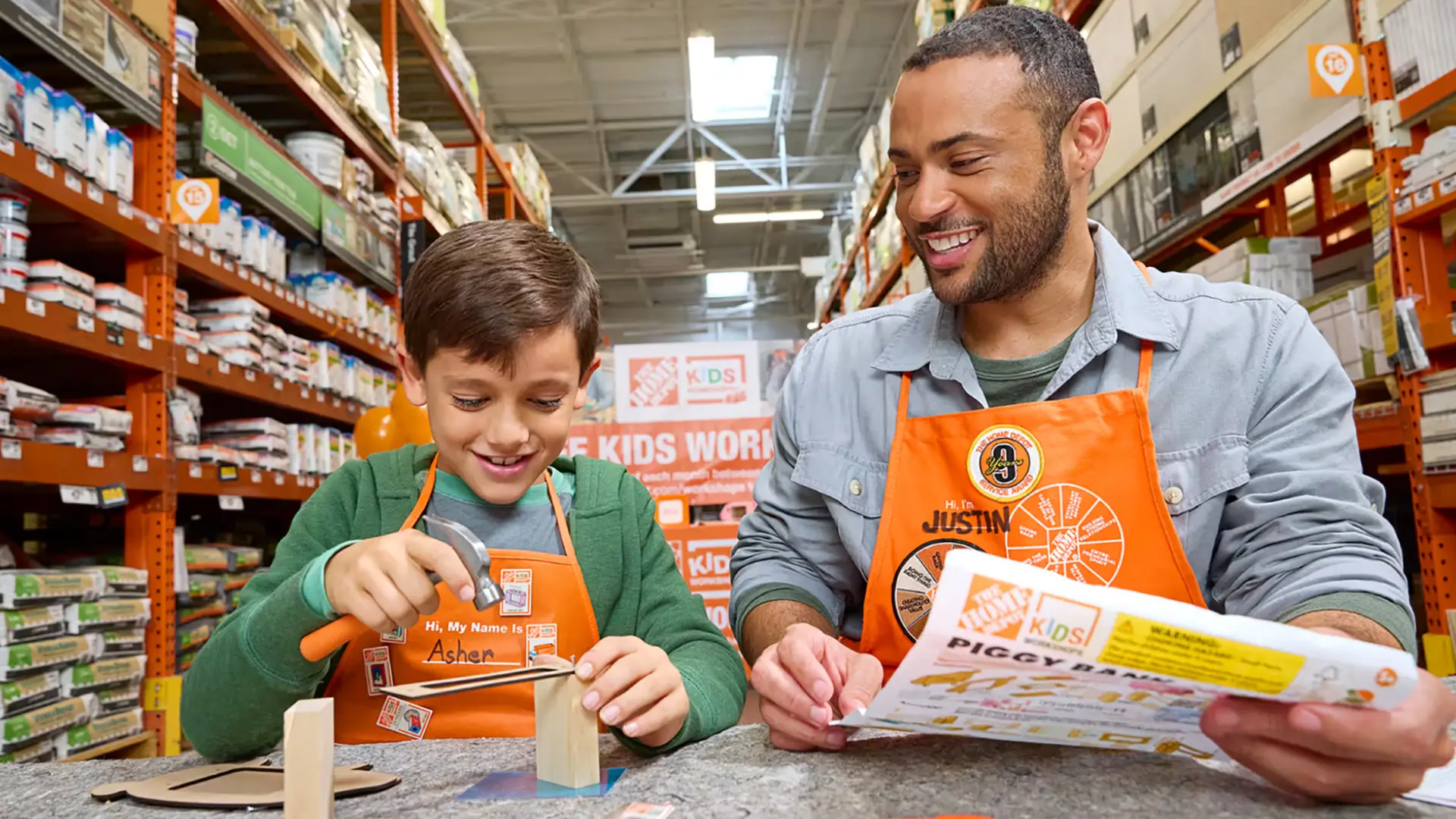 Child building small wood project with hammer at store workshop, guided by friendly adult instructor nearby