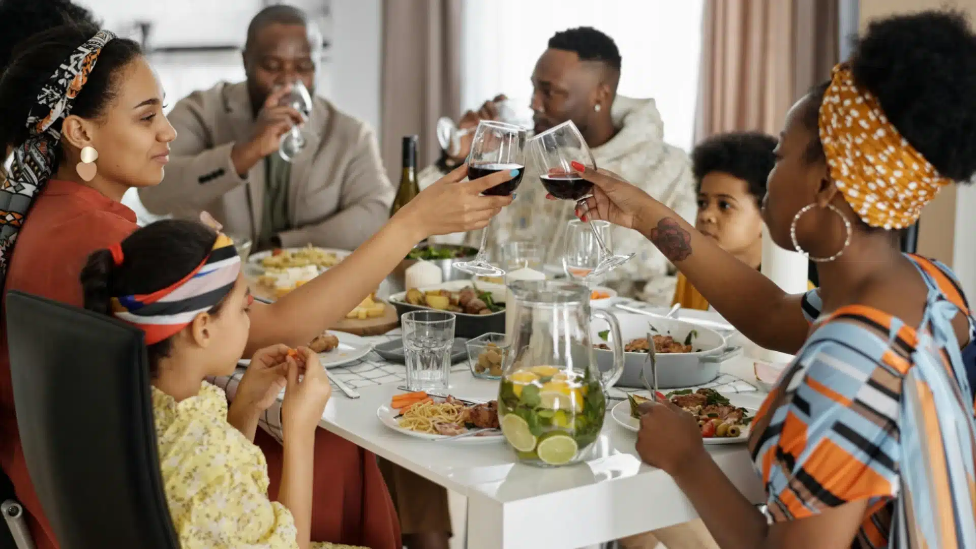 Family gathered at dining table sharing meal and toasting with wine glasses in a warm home setting