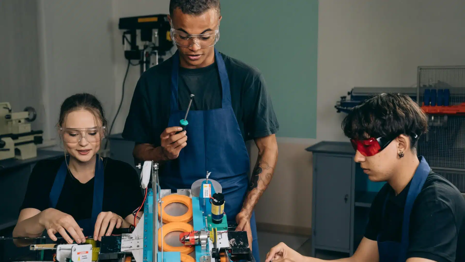 Group working on a DIY art project together, assembling creative pieces in a workshop setting