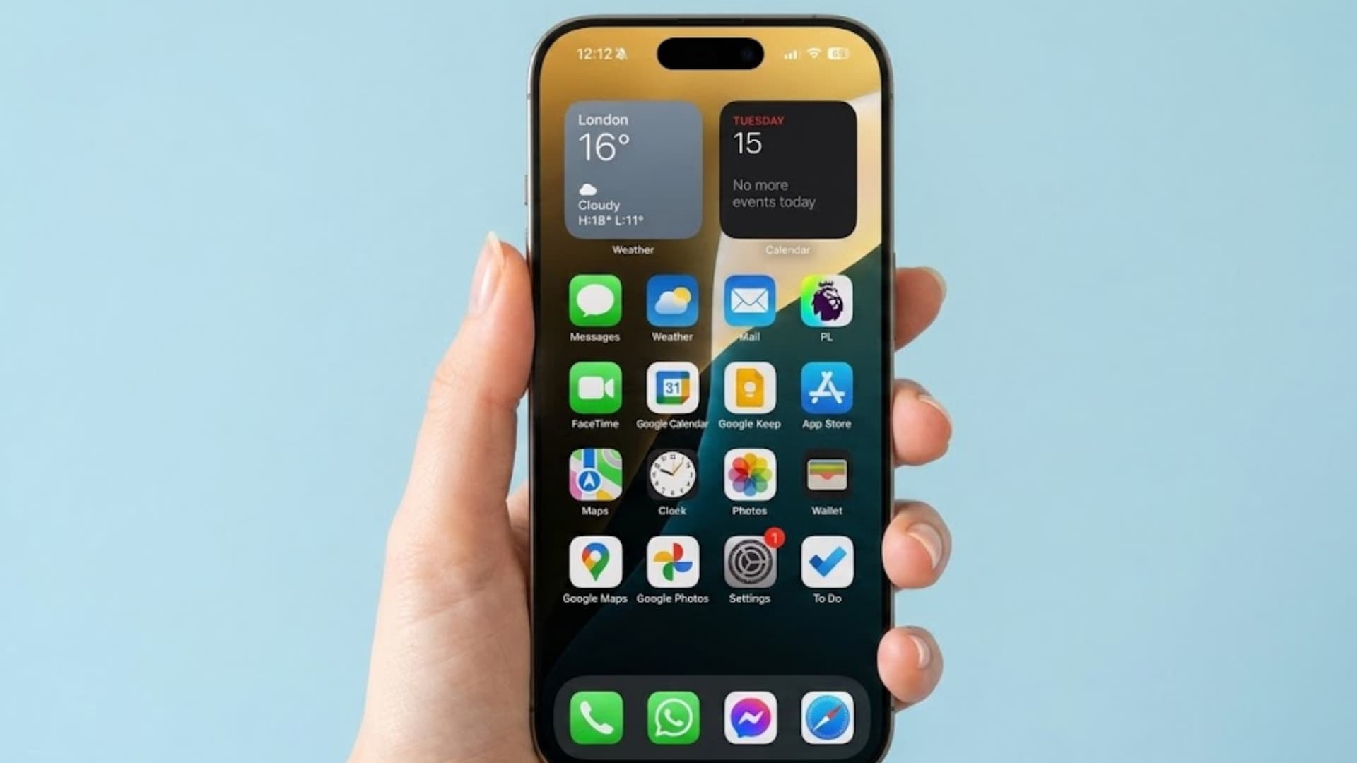 Hand holding smartphone with home screen apps and widgets visible