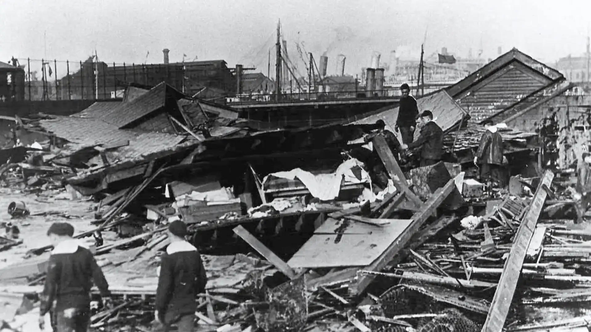 Boston Molasses Flood aftermath shows collapsed buildings and workers searching through thick debris and wreckage