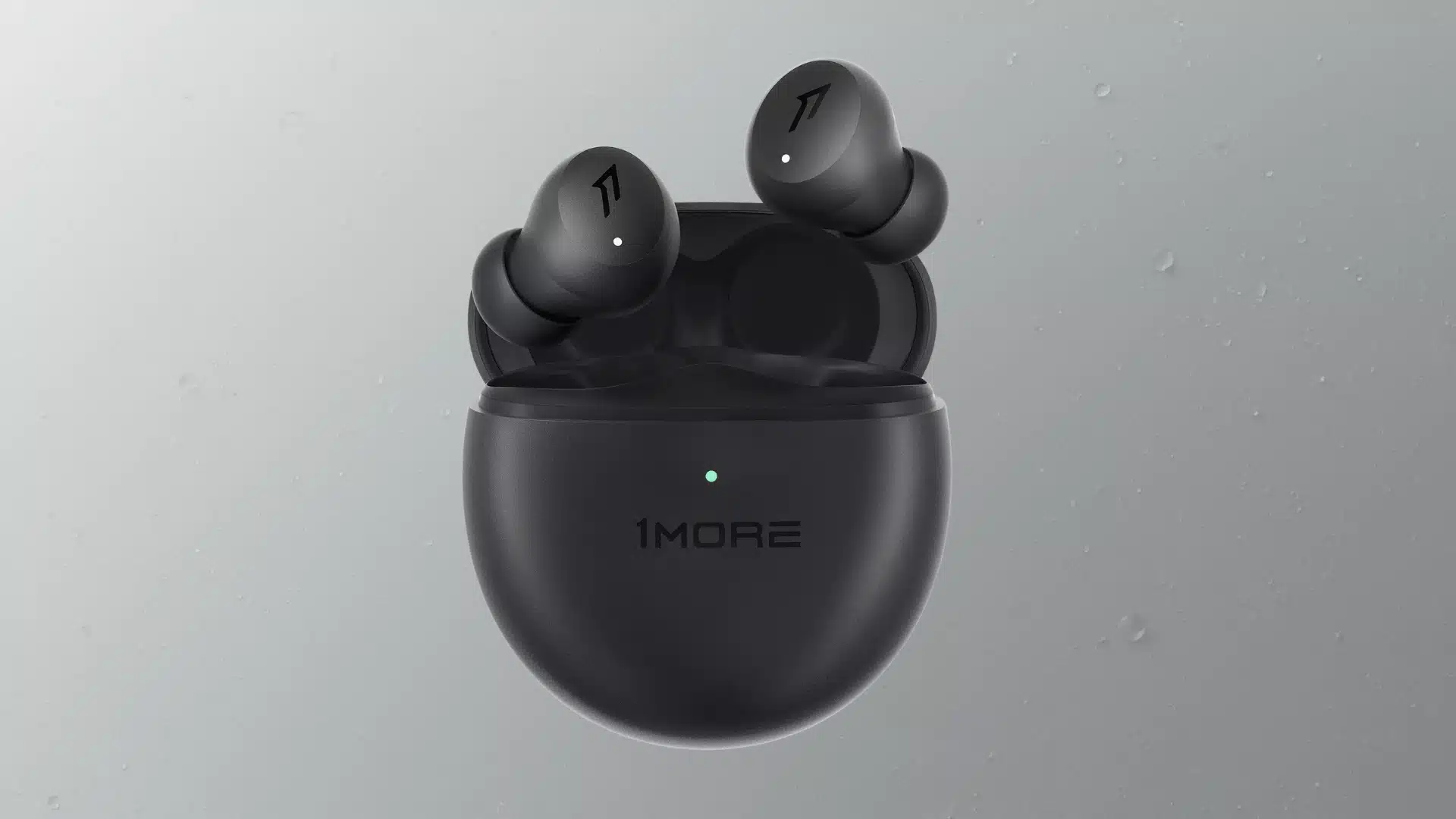 1MORE wireless earbuds in matte black charging case with LED light on neutral background