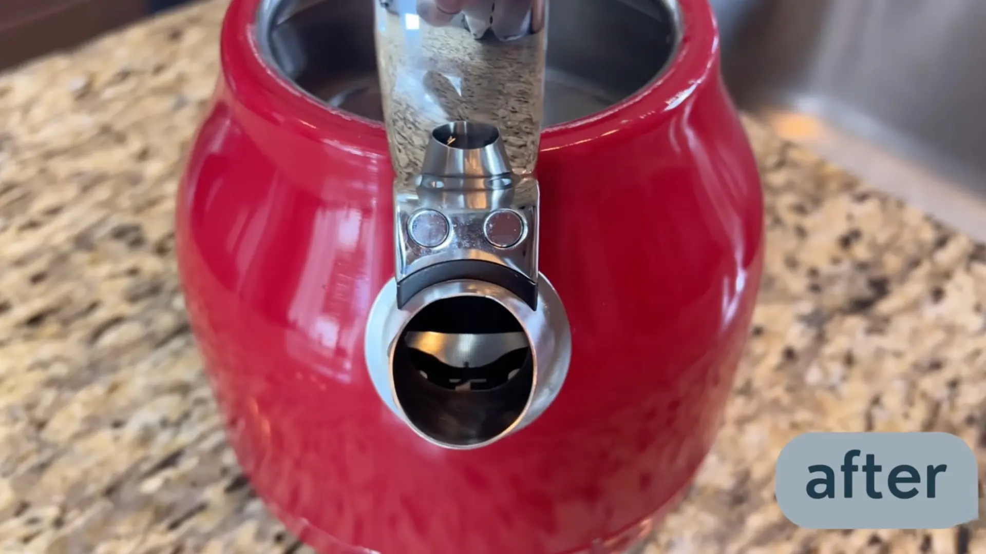 Clean red kettle interior after descaling with vinegar showing removed mineral buildup