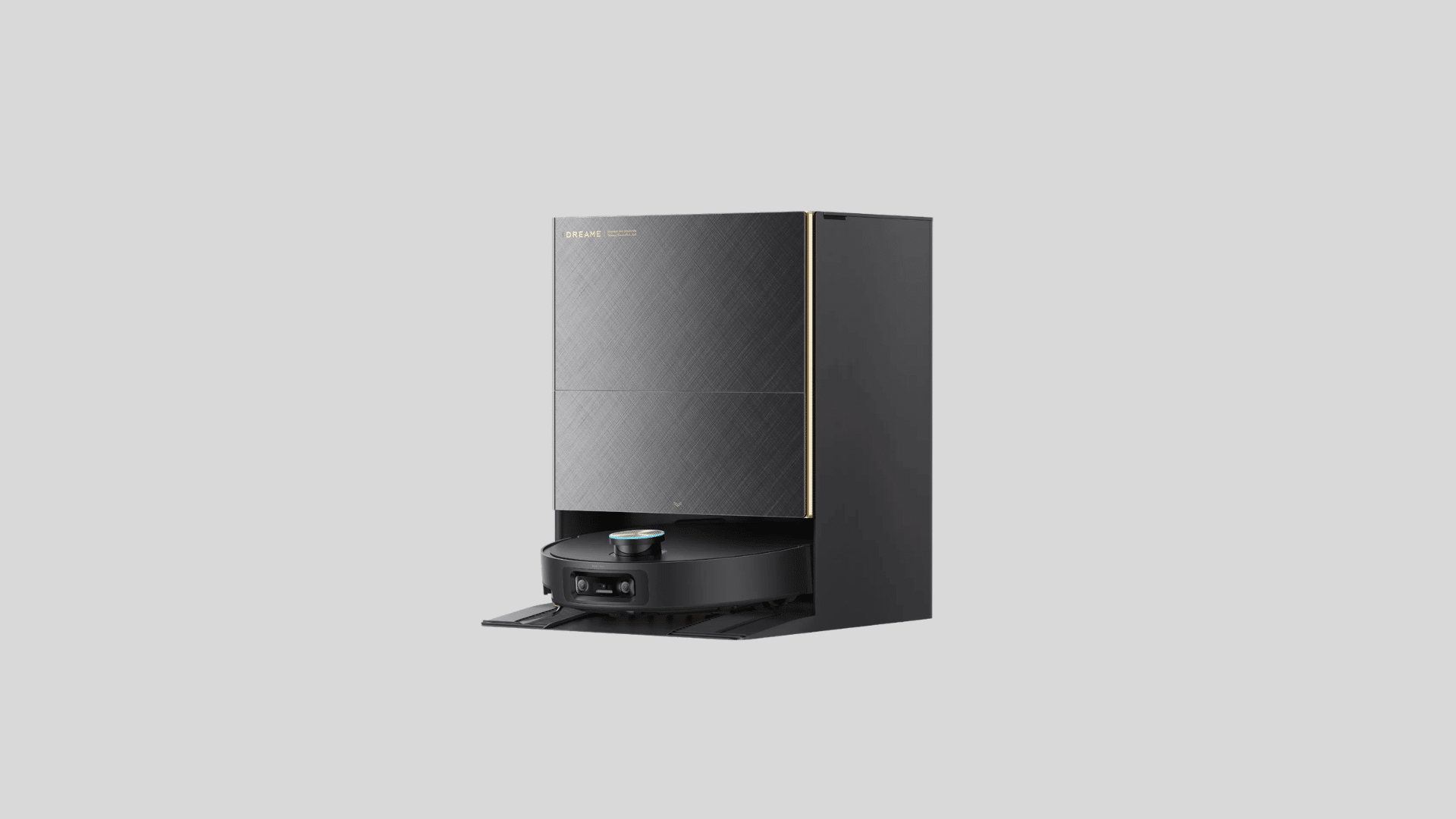 Dreame robot vacuum with docking station in black and gold finish on a grey background, showing sleek design