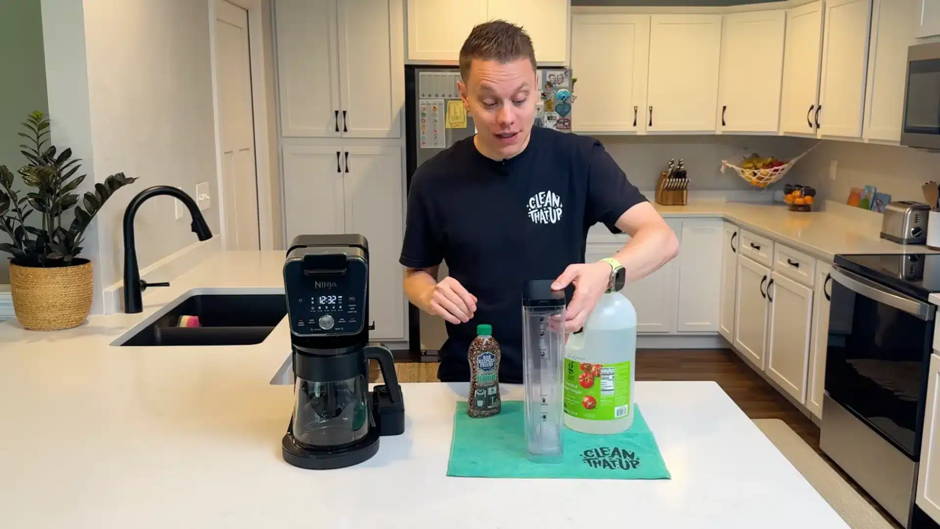 Person preparing coffee maker descaling solution with vinegar and cleaner beside machine