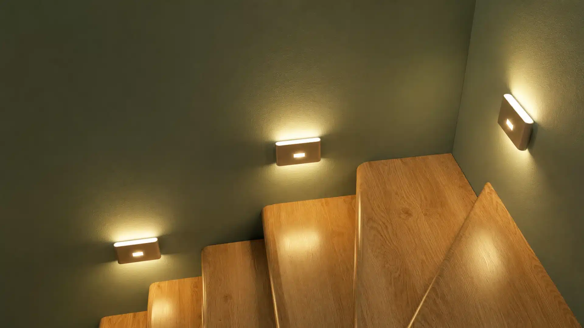 Small, rectangular LED wall lights cast a warm glow down onto a set of modern wooden stairs
