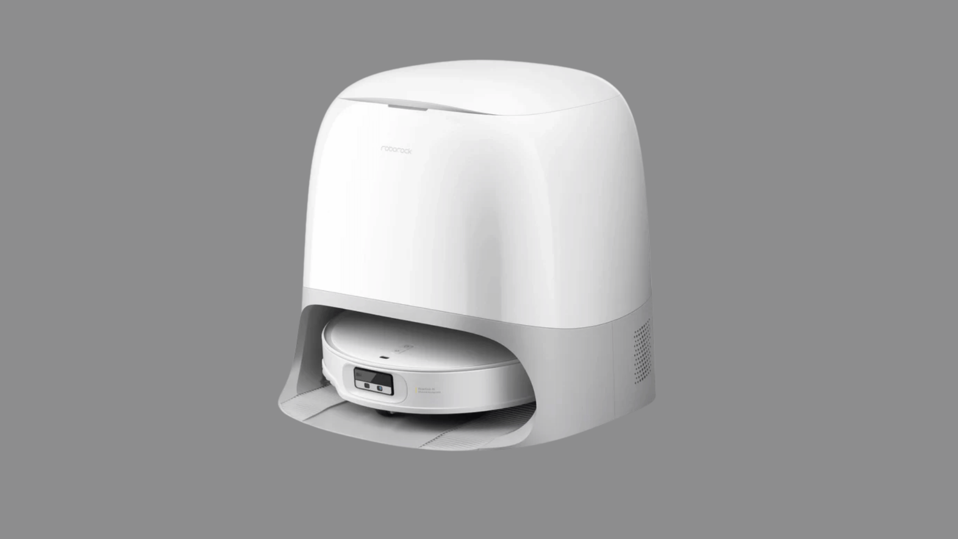 White Roborock robot vacuum inside a matching docking station on a dark background with a clean modern look