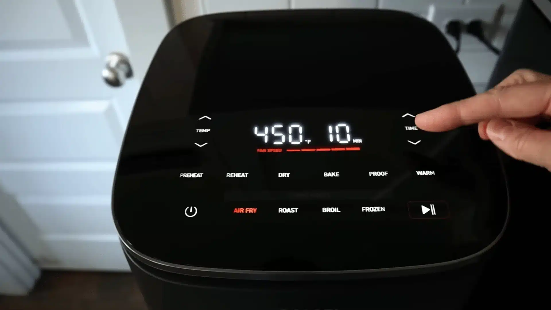 Air fryer control panel set to 450°F for 10 minutes in air fry mode