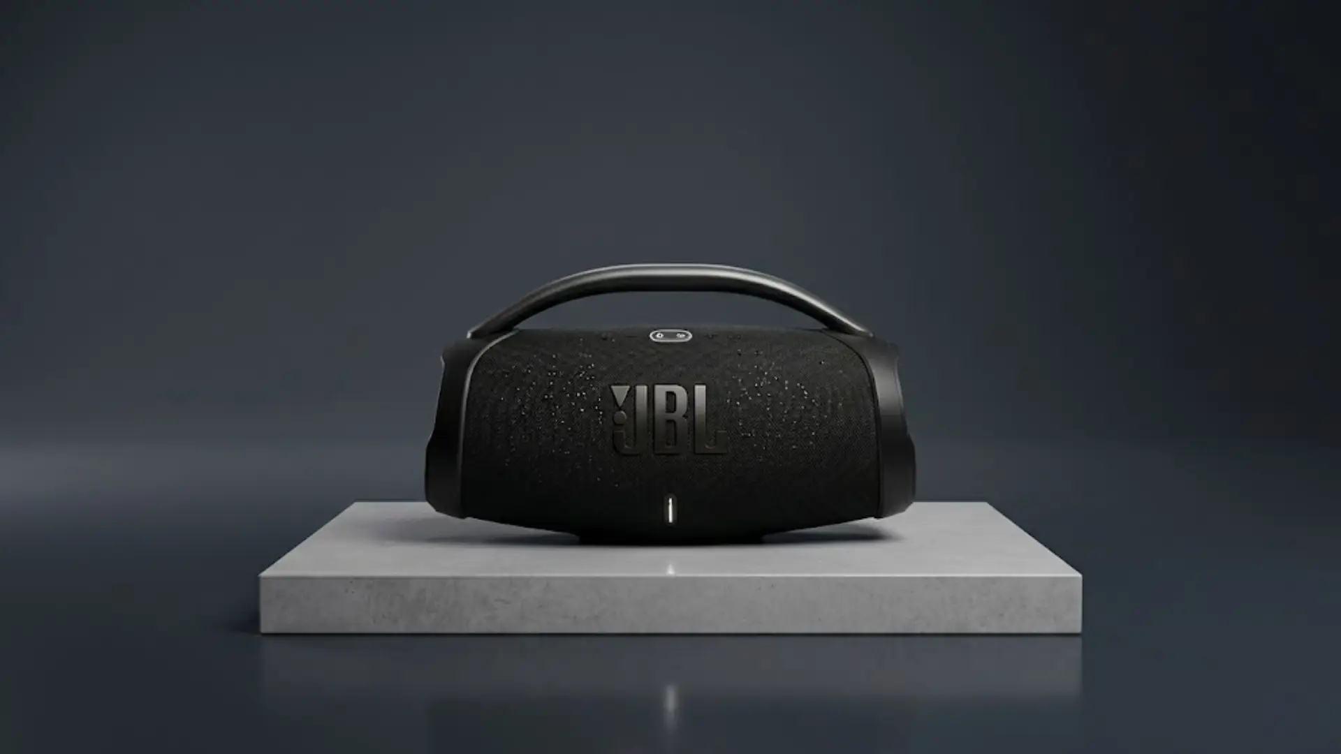 Black JBL portable speaker on pedestal with handle, minimal dark background, product showcase style