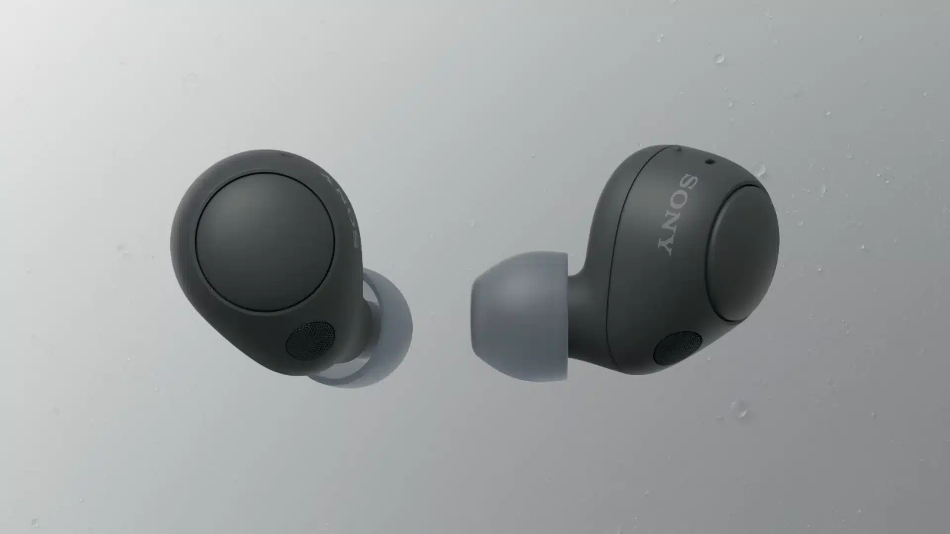 Black Sony earbuds side view showing compact rounded shape with silicone ear tips