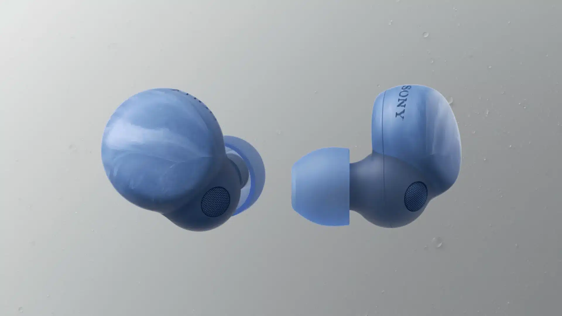 Blue Sony wireless earbuds close up showing soft silicone tips and rounded compact design