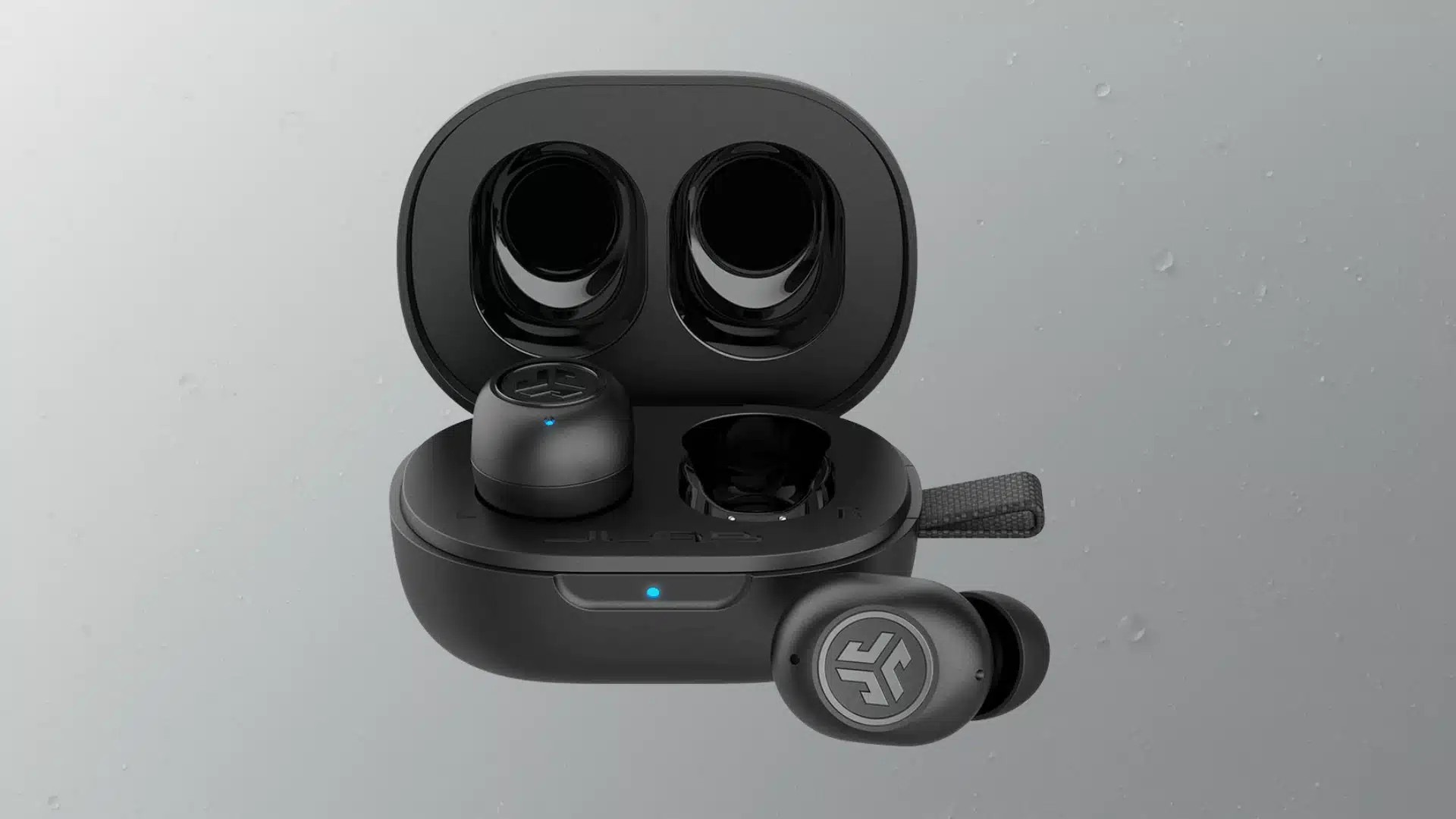 Compact black true wireless earbuds in open case with one earbud outside and blue status lights