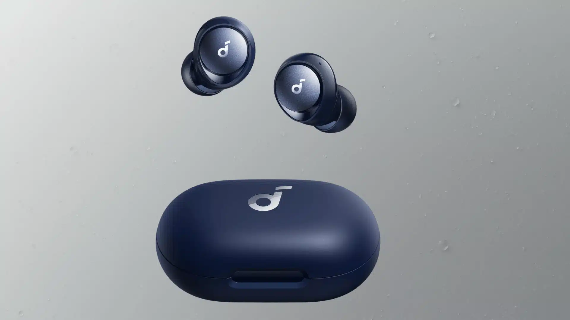 Dark blue Soundcore earbuds floating above matching charging case with minimal logo design