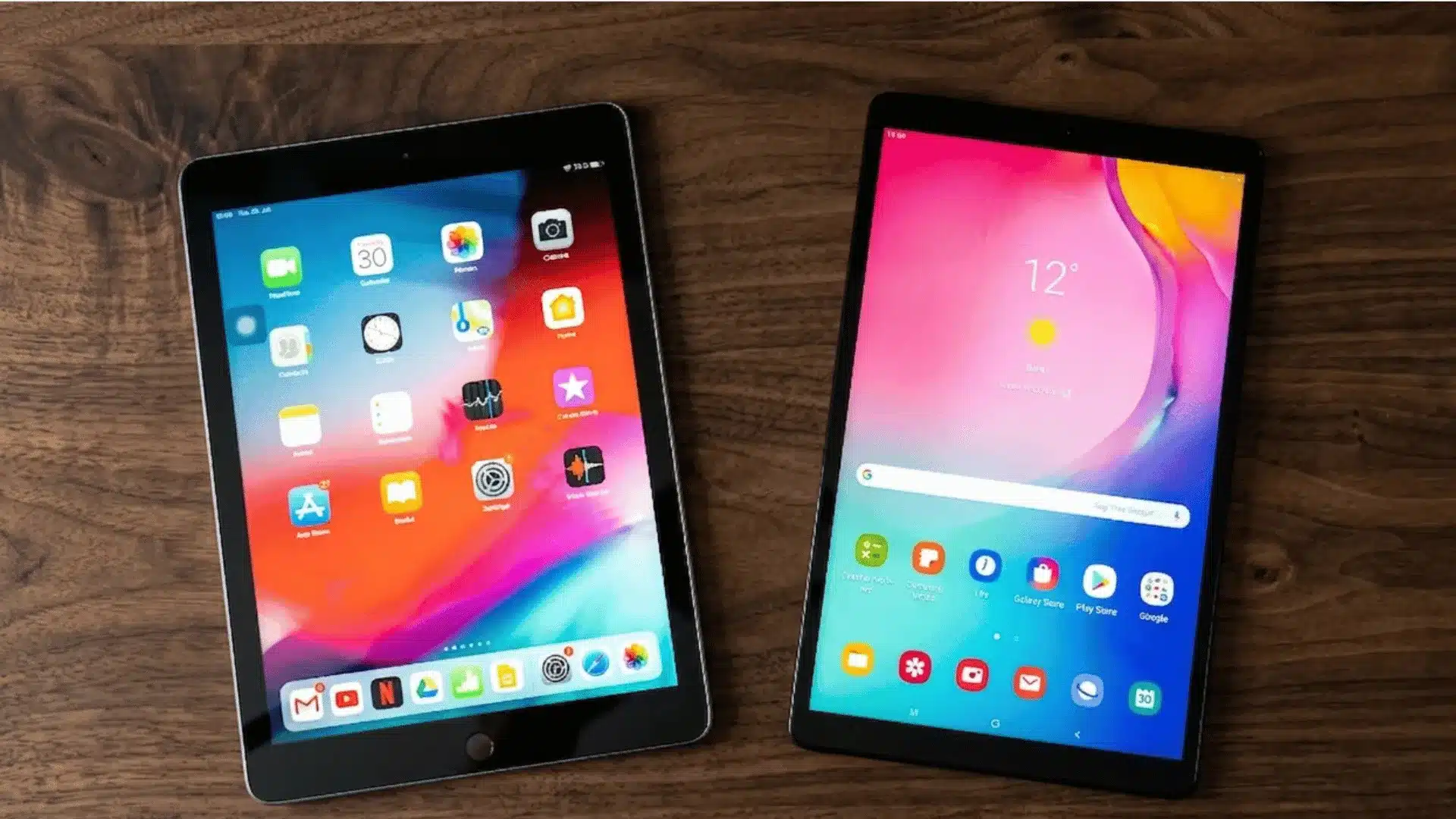 iPad and Samsung tablet side by side comparison for creative work and digital drawing on a wooden desk