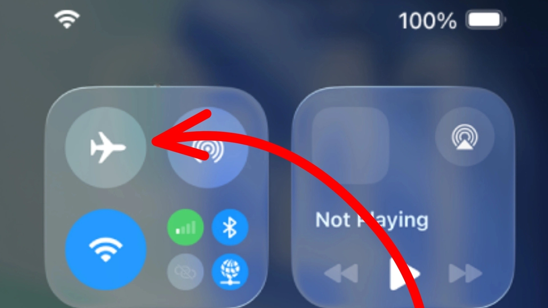 iPhone Control Center with red arrow pointing to the airplane mode button for enabling flight mode