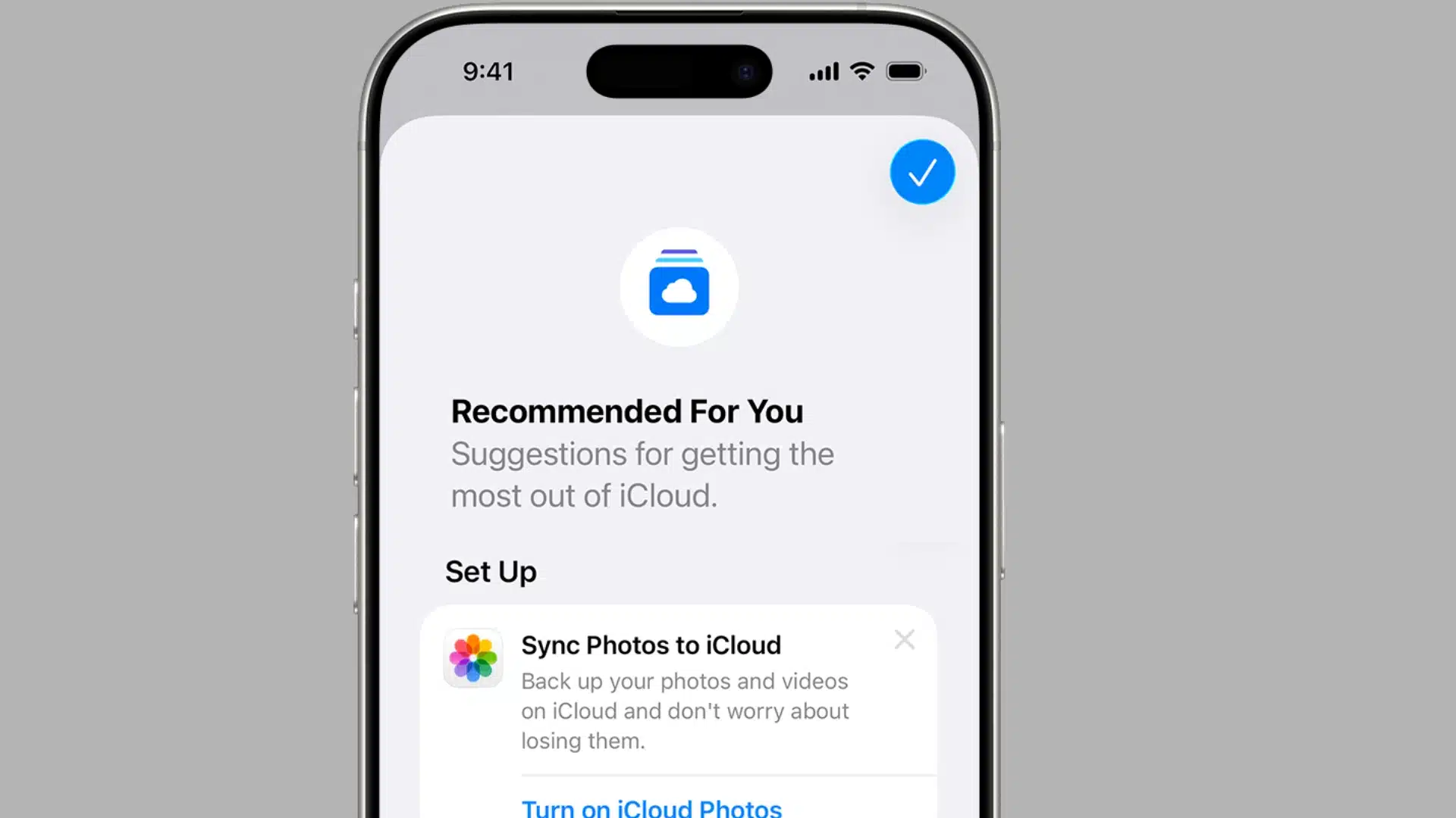 iPhone screen showing the “Recommended For You” section in iCloud settings with options to sync photos and manage storage