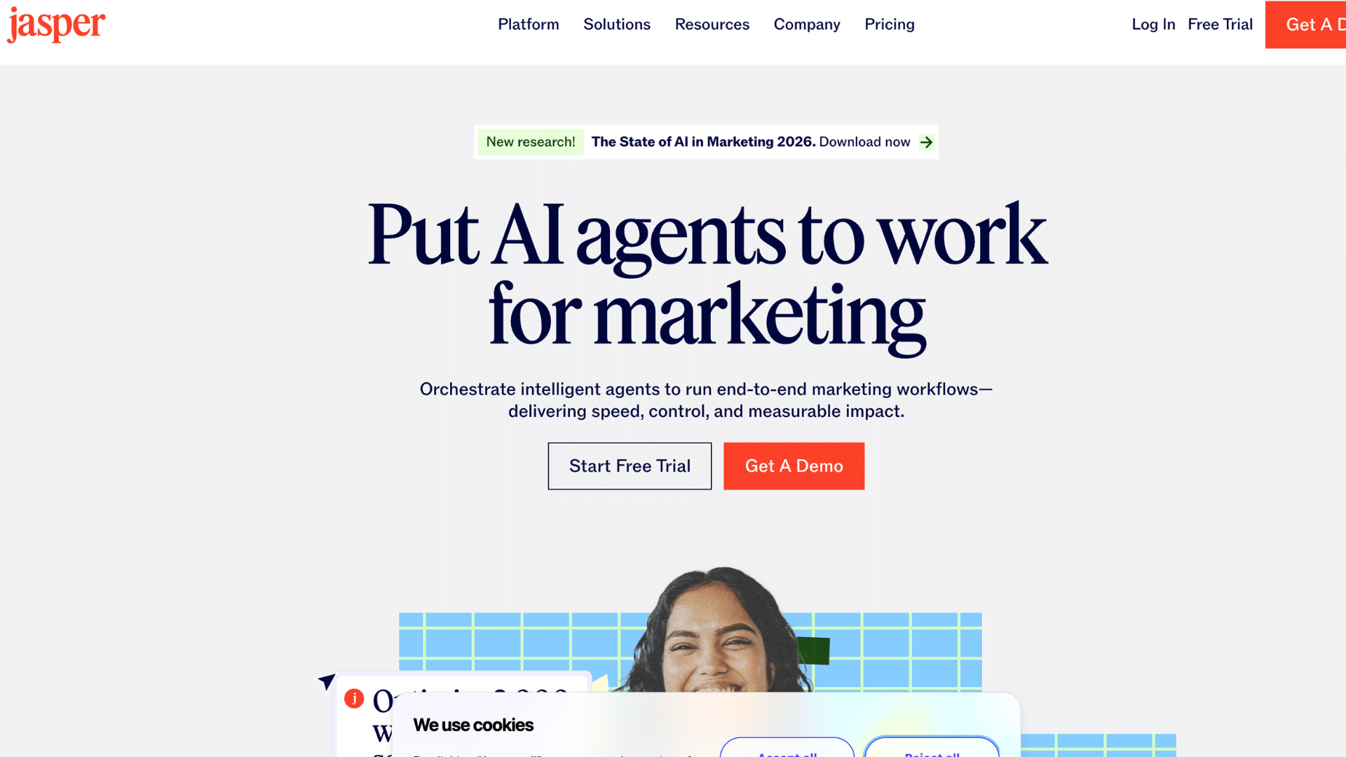 jasper homepage with ai marketing headline action buttons and cookie banner at the bottom of the screen