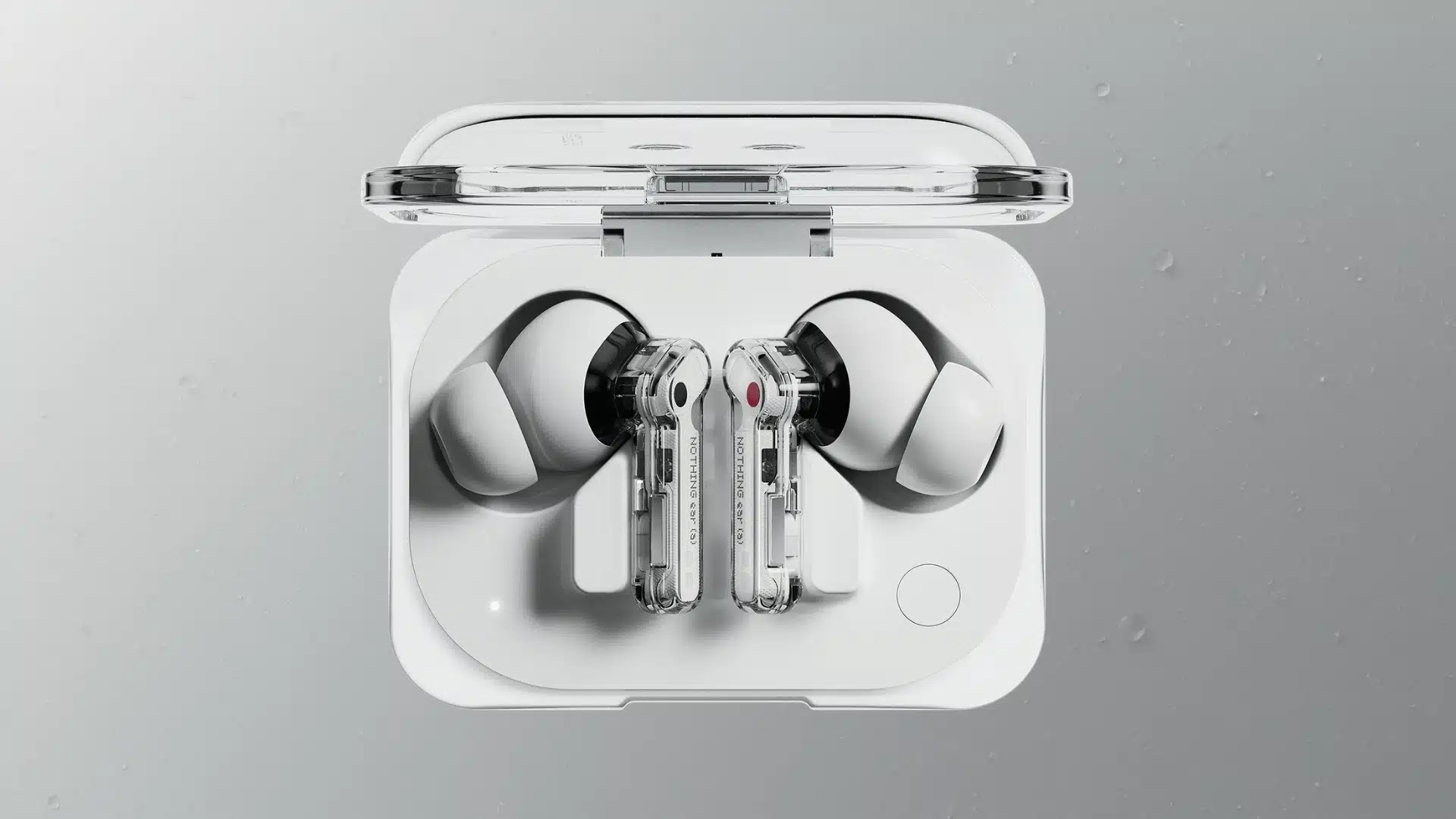 Nothing Ear (a) wireless earbuds in open charging case with transparent stems and silicone ear tips on display