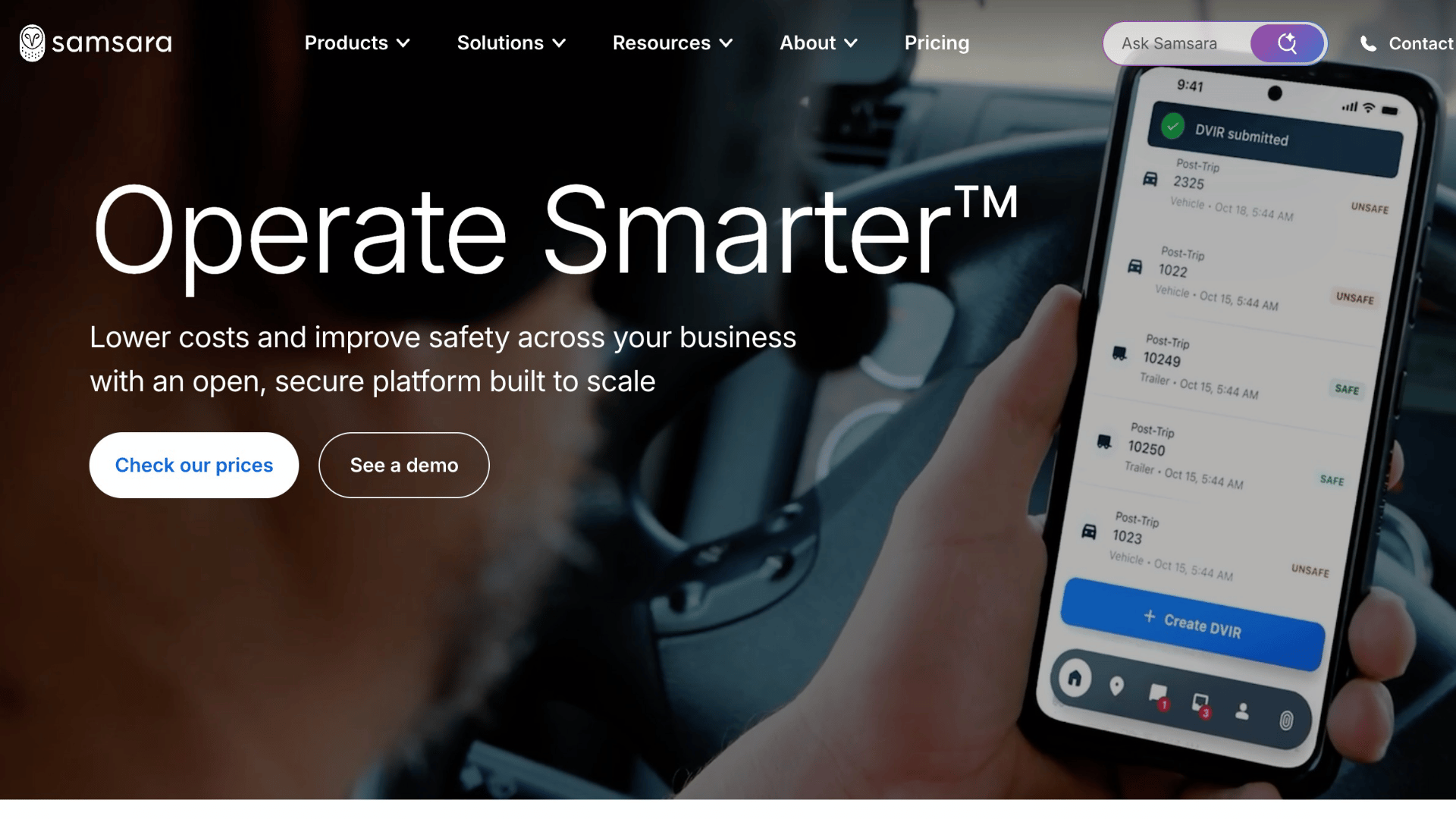 samsara website featuring text operate smarter and a person holding a smartphone showing an app interface inside a vehicle