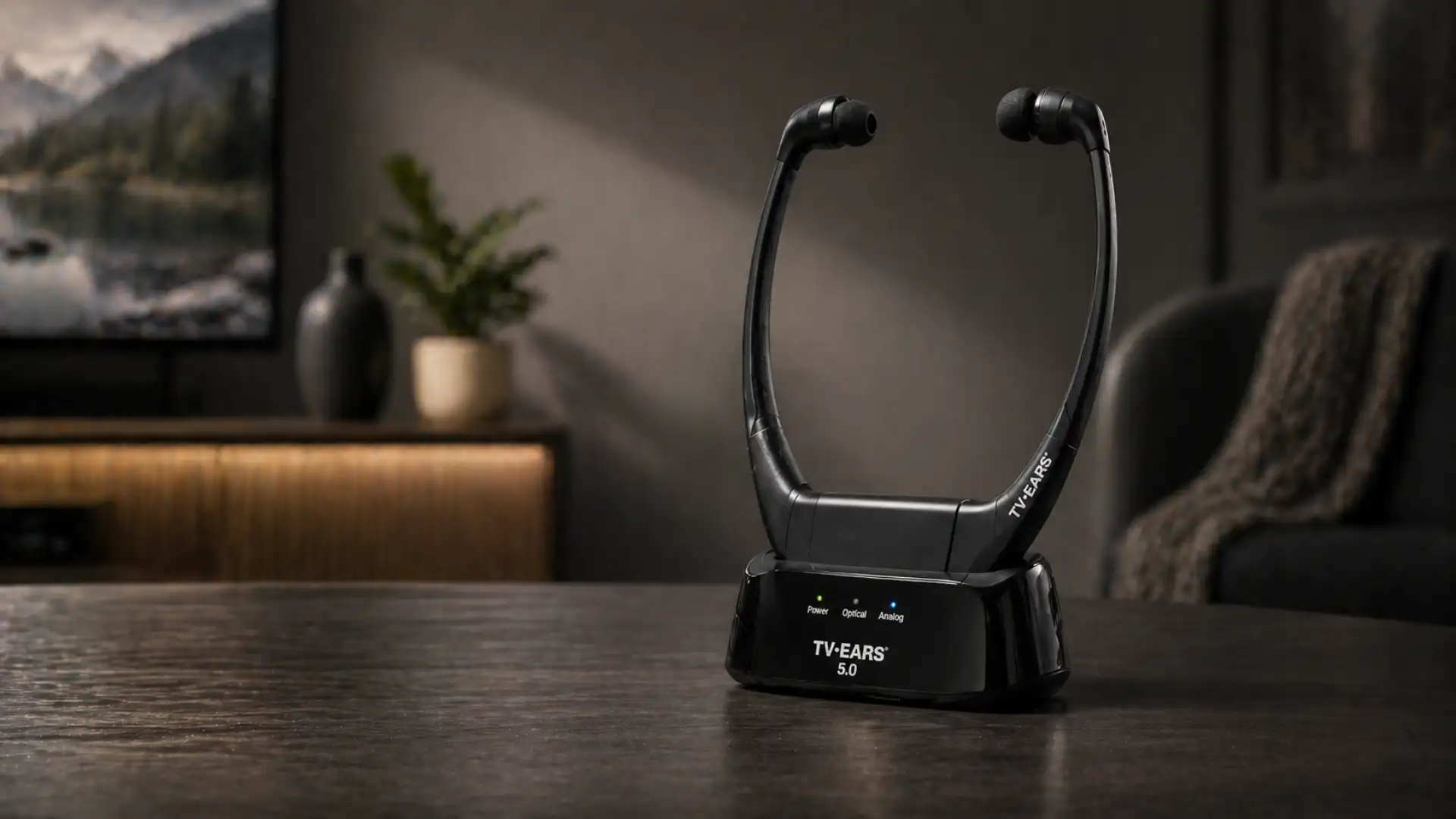 TV Ears 5.0 wireless neckband headphones on charging base in living room with soft lighting