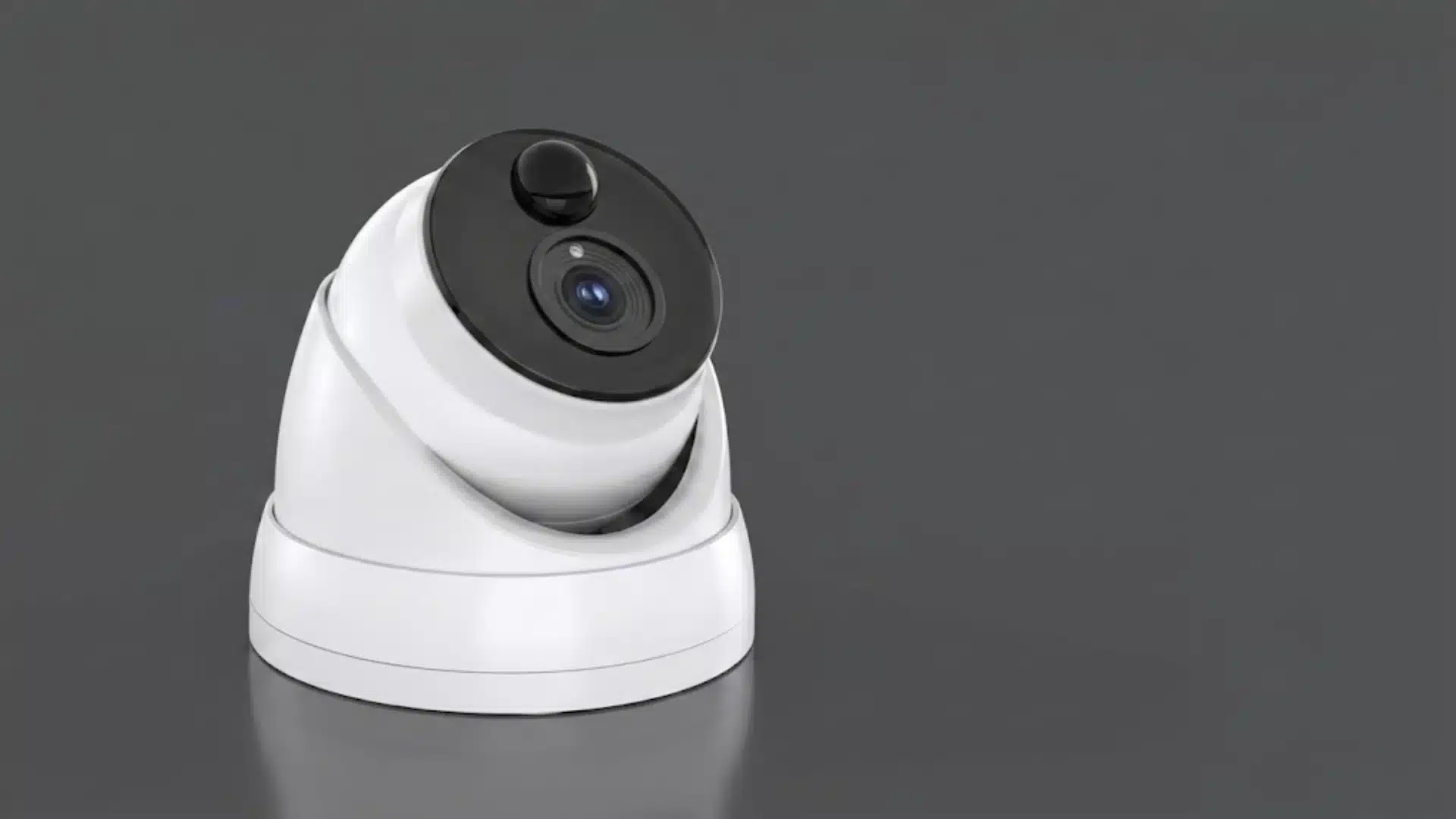 A white dome security camera with a black lens face, positioned on a dark gray background png