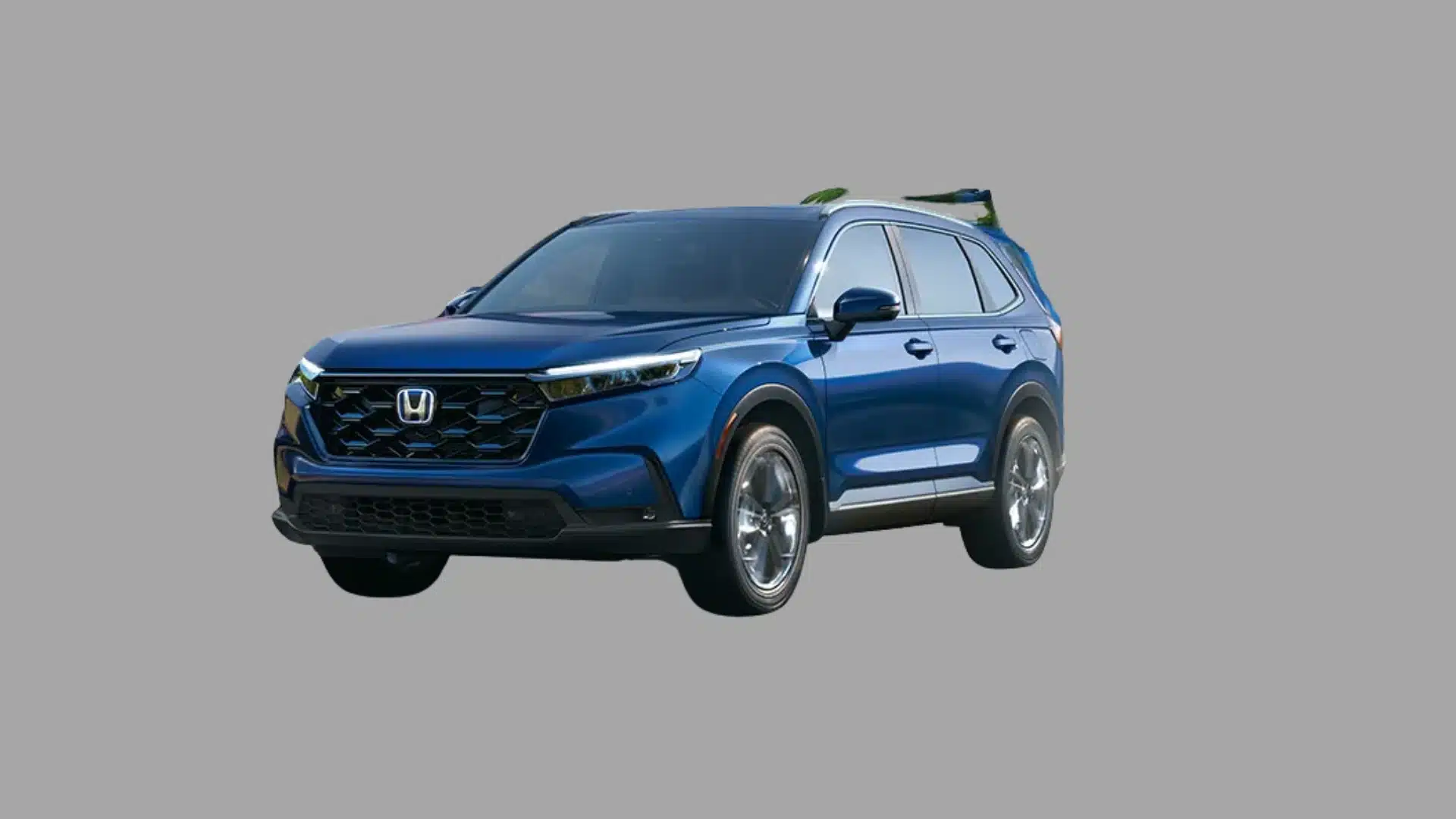 Blue Honda CR-V hybrid SUV parked on a plain gray background with a modern crossover design