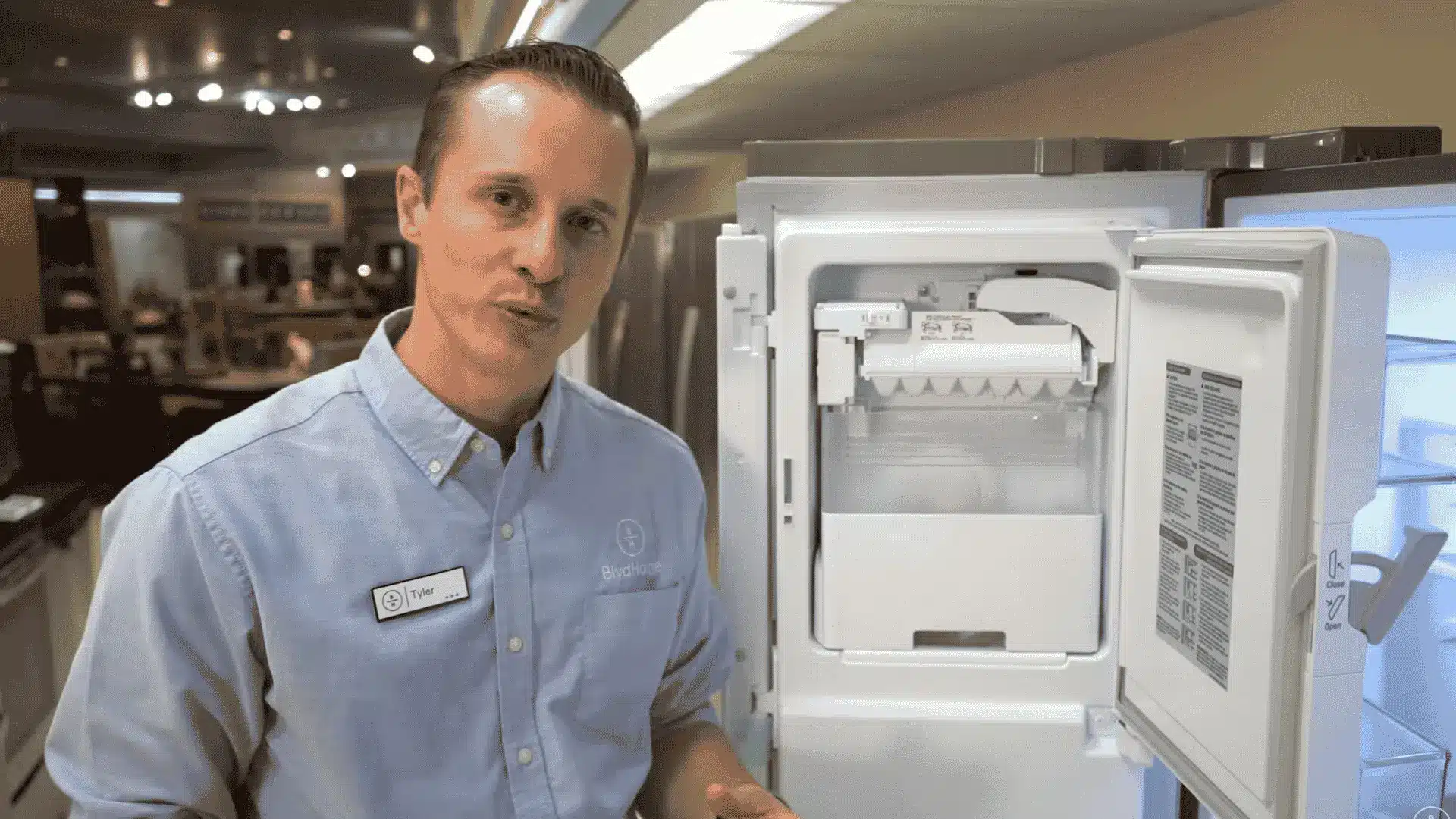 BoulevardHome technician showing the Frigidaire ice maker on off switch inside the freezer
