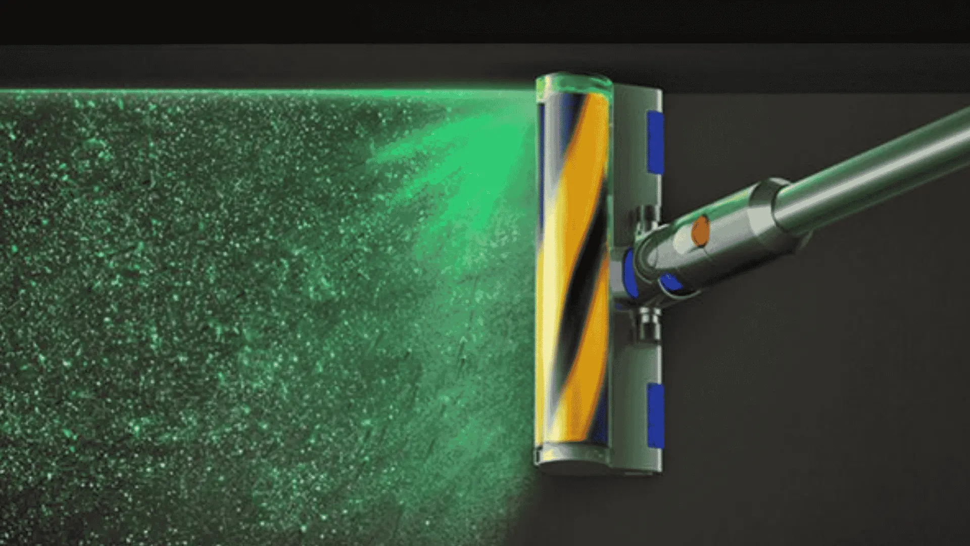 Dyson vacuum cleaner head using green laser dust detection to reveal fine particles on a dark floor
