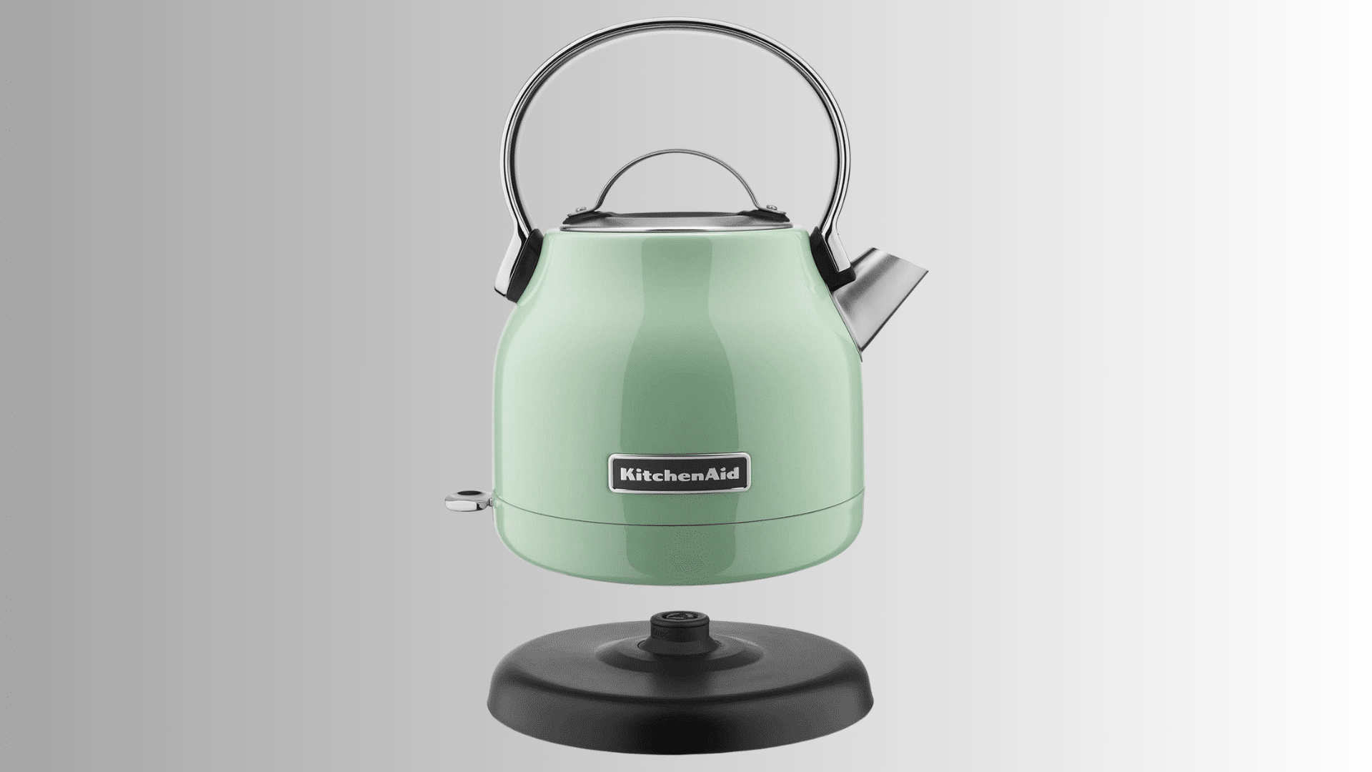 kitchenaid electric kettle in light green with stainless steel handle spout and detachable base stand